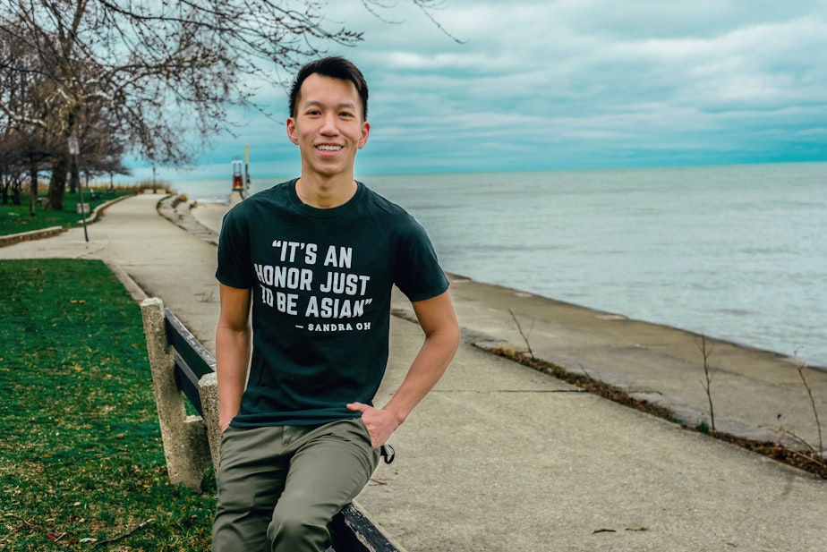 caption: Simon Tran sits for a portrait in Chicago, March 2021.