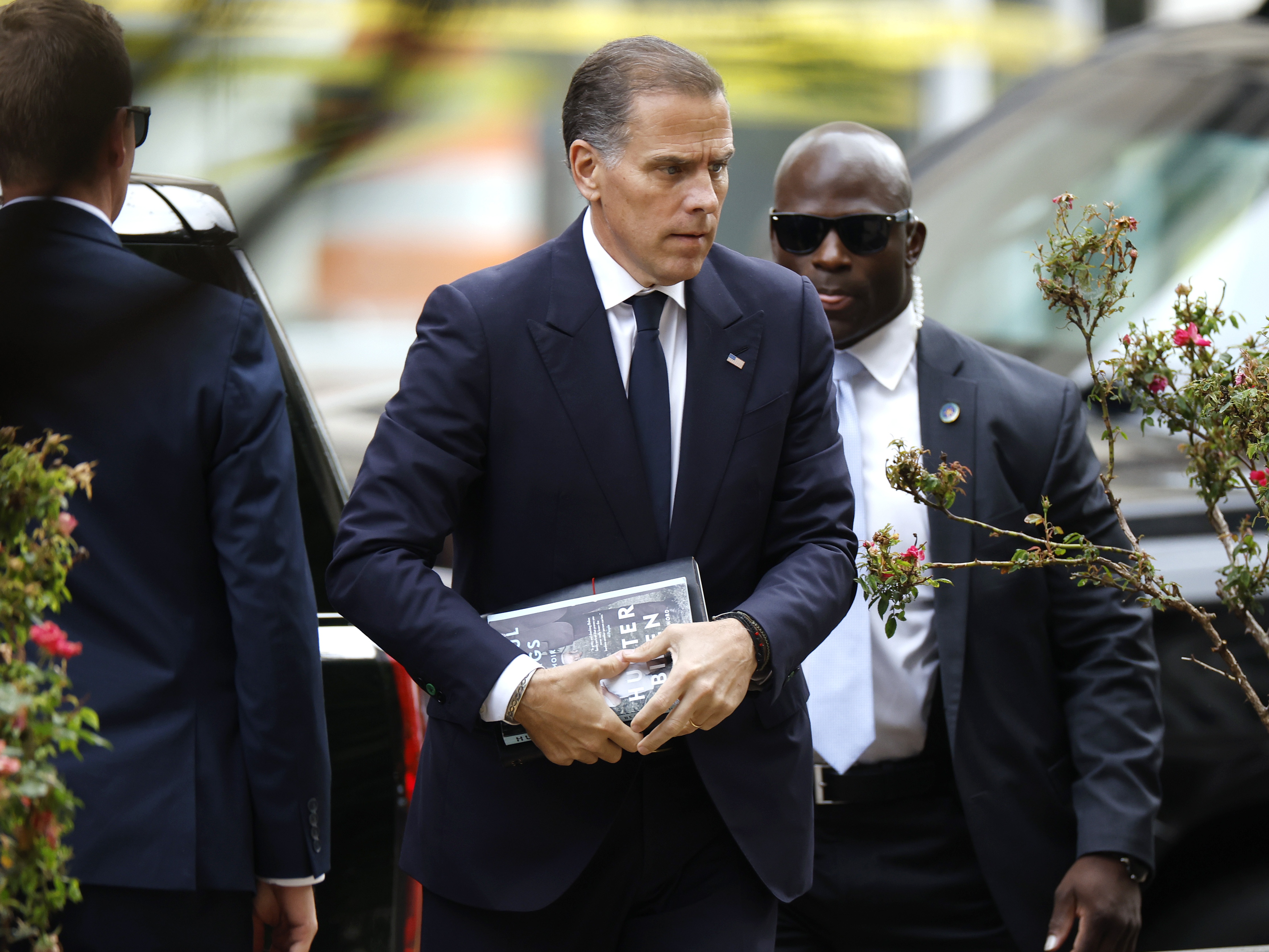 caption: Hunter Biden arrives at the J. Caleb Boggs Federal Building in Wilmington, Del., in June during his trial on felony gun charges.