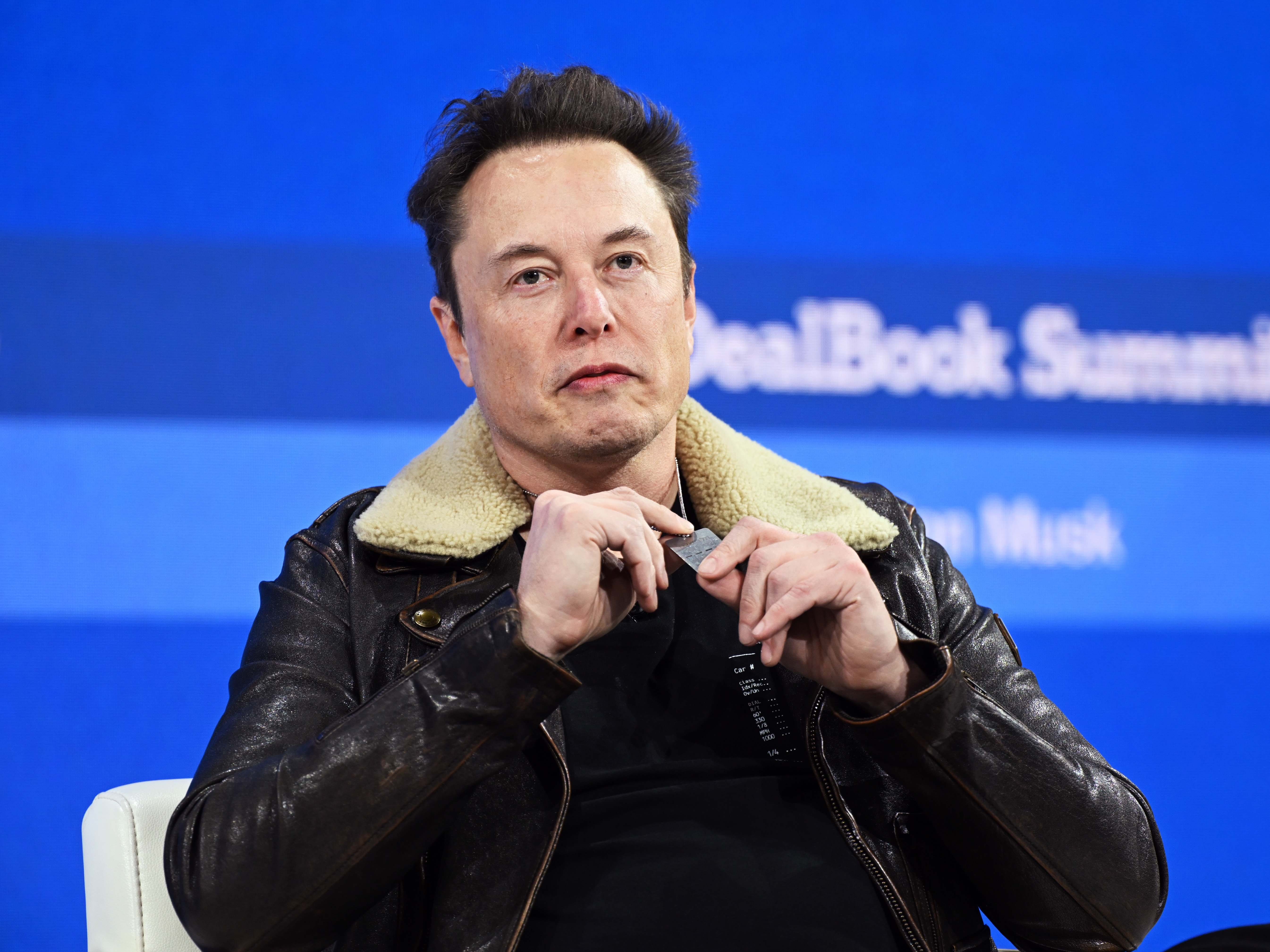 caption: Elon Musk at <em>The New York Times </em>Dealbook conference in November 2023, when he criticized advertisers for boycotting his social media platform, X, after Media Matters and other groups reported on the rise of extremist content on the platform since his 2022 purchase.