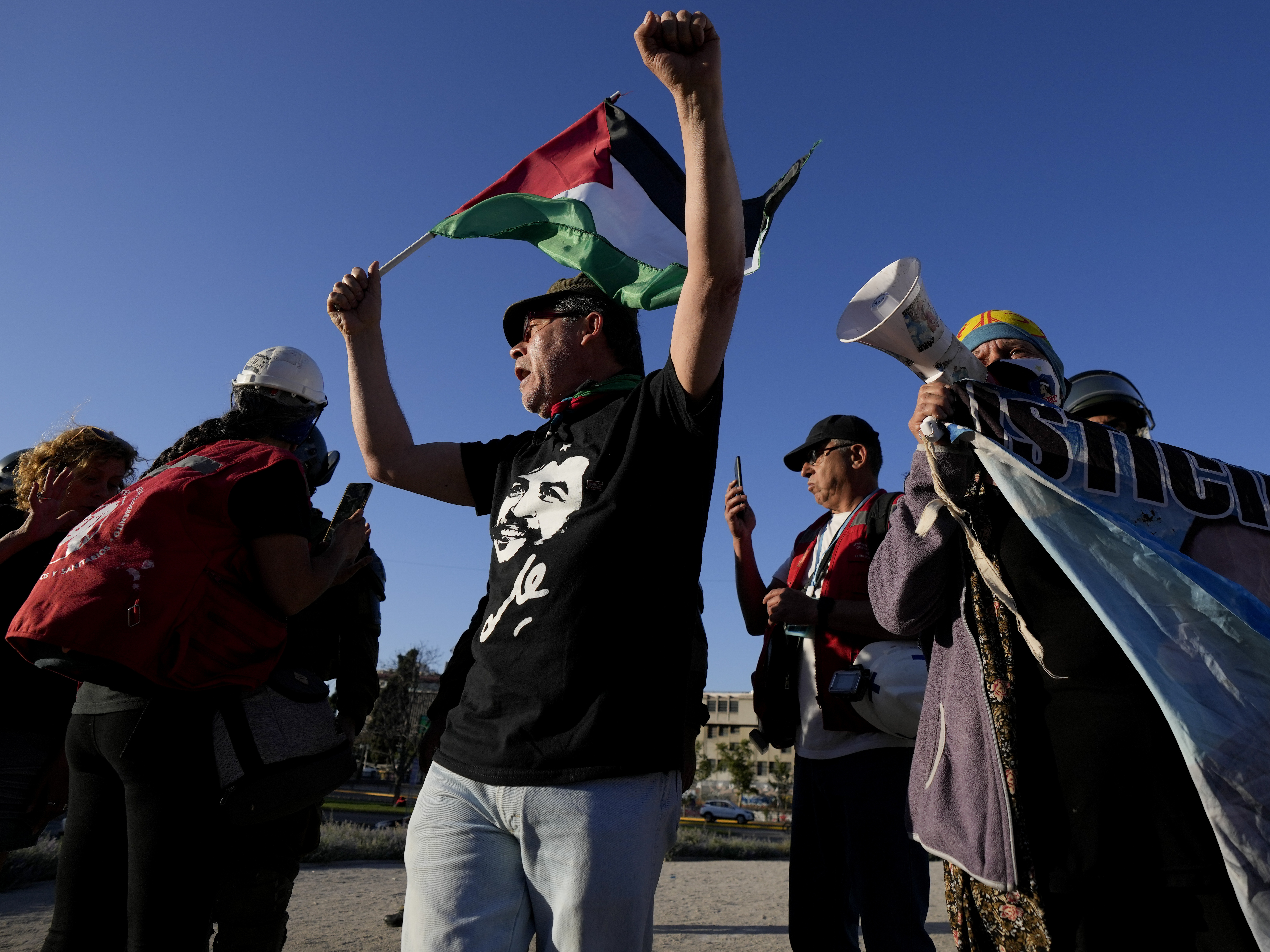 caption: People against the draft of a new constitution celebrate after the polls closed in Santiago, Chile, Sunday, Dec. 17, 2023.