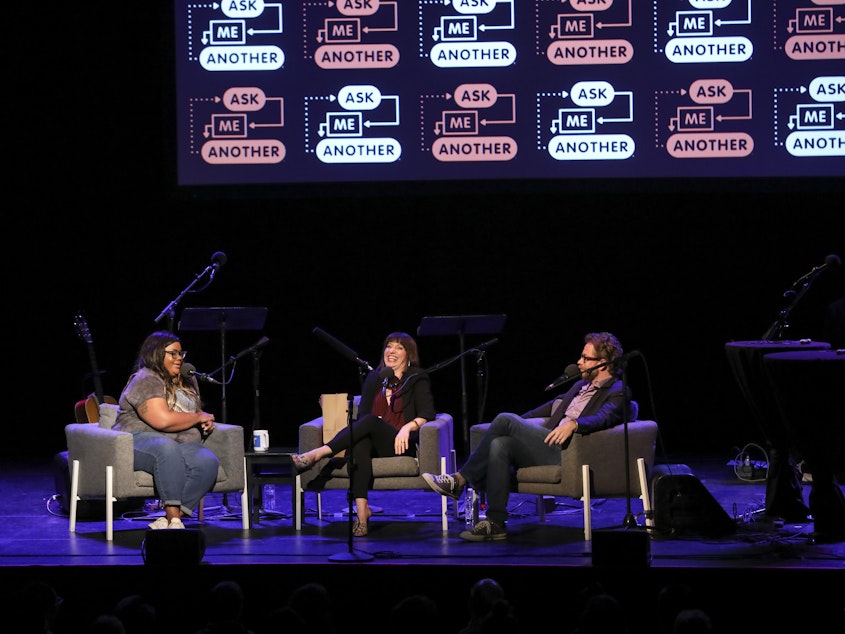 caption: Comedian Nicole Byer is quizzed on the movie <em>Ghost</em>, alongside <em>Ask Me Another</em> host Ophira Eisenberg and Jonathan Coulton at the Moore Theatre, in Seattle, Washington.