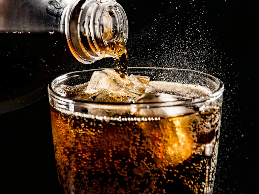 caption: Drinking artificially sweetened diet sodas may lead to increase in appetite and weight gain, research finds.