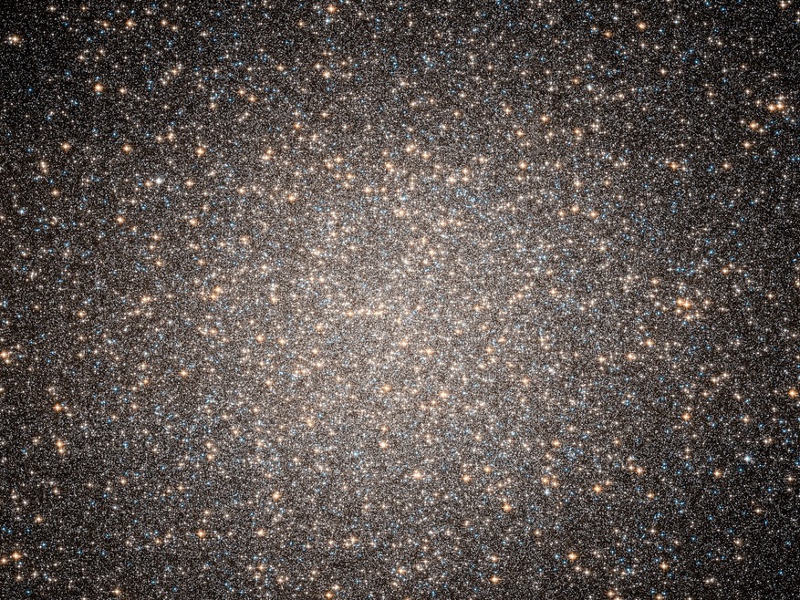caption: The star cluster Omega Centauri contains millions of stars. The movement of some stars suggests that an intermediate-sized black hole lies at its center. 
