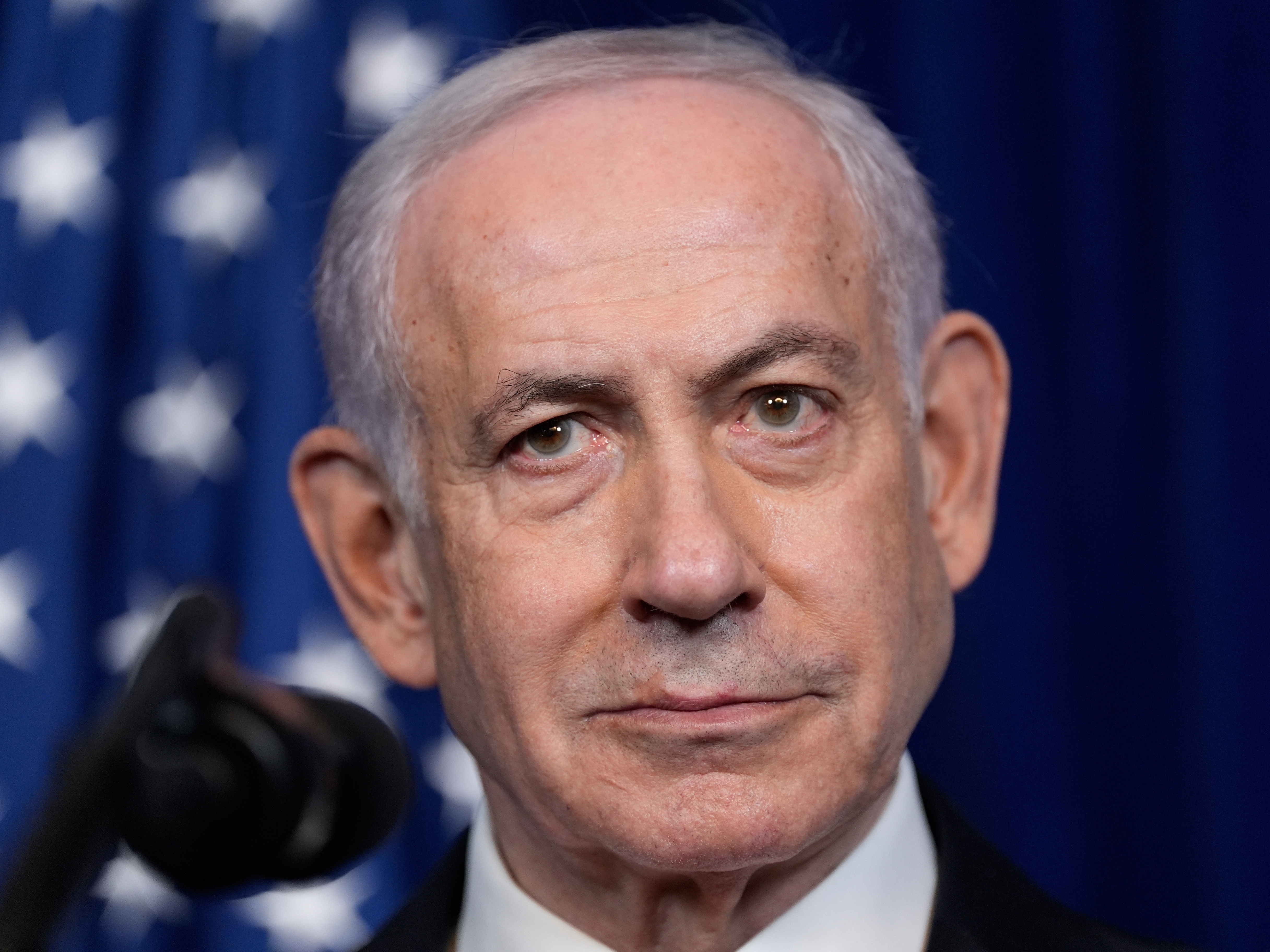 caption: Israel's Prime Minister Benjamin Netanyahu listens during a news conference with President Donald Trump at Mar-a-Lago, Monday, Dec. 29, 2025, in Palm Beach, Fla.