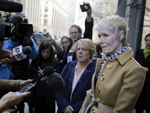 caption: On Twitter, E. Jean Carroll (right) slammed the Department of Justice's attempt to take over her defamation suit against President Trump, telling him to "bring it."
