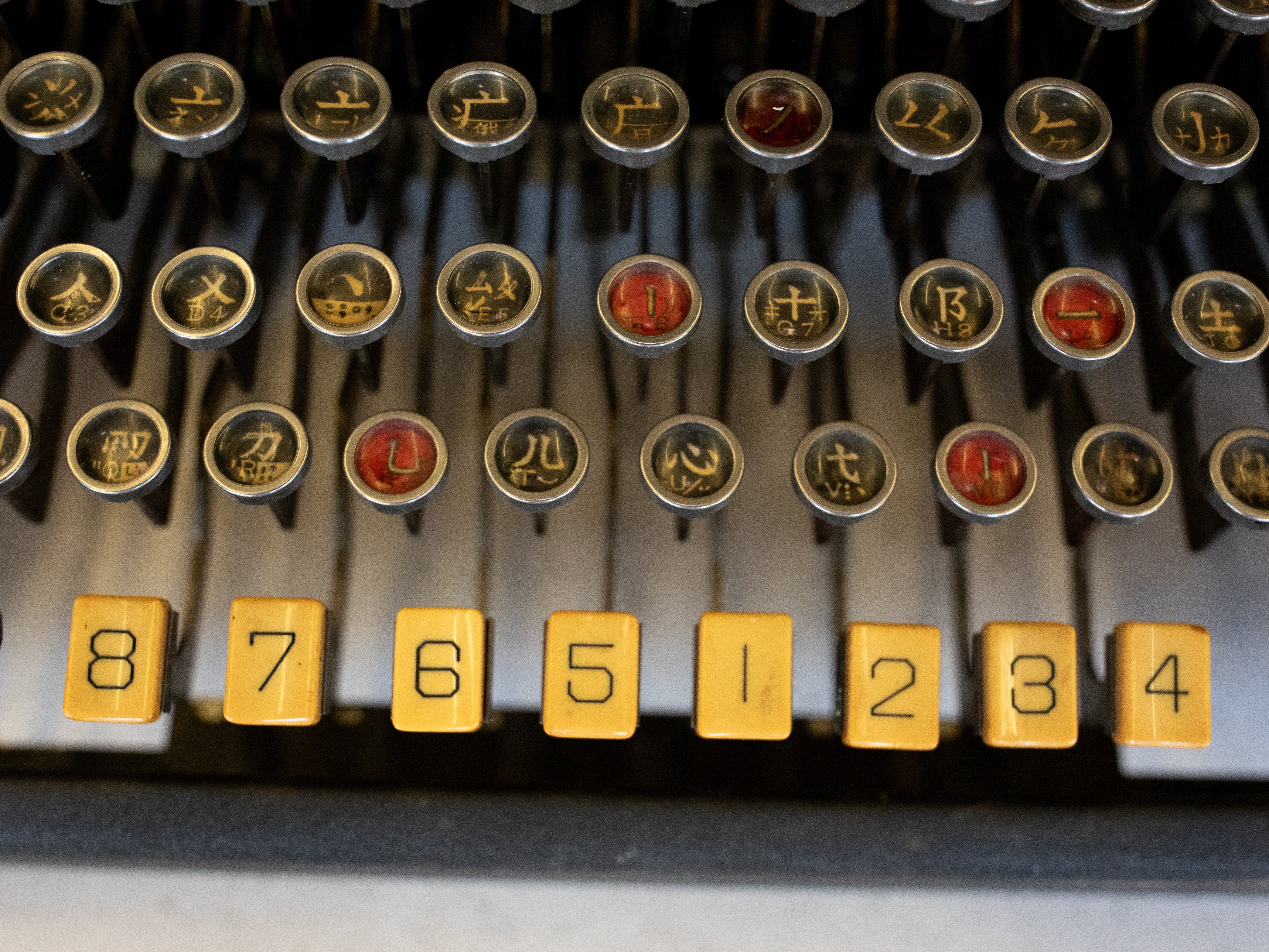 caption: The MingKwai typewriter's keys enable the typist to find and retrieve Chinese characters.