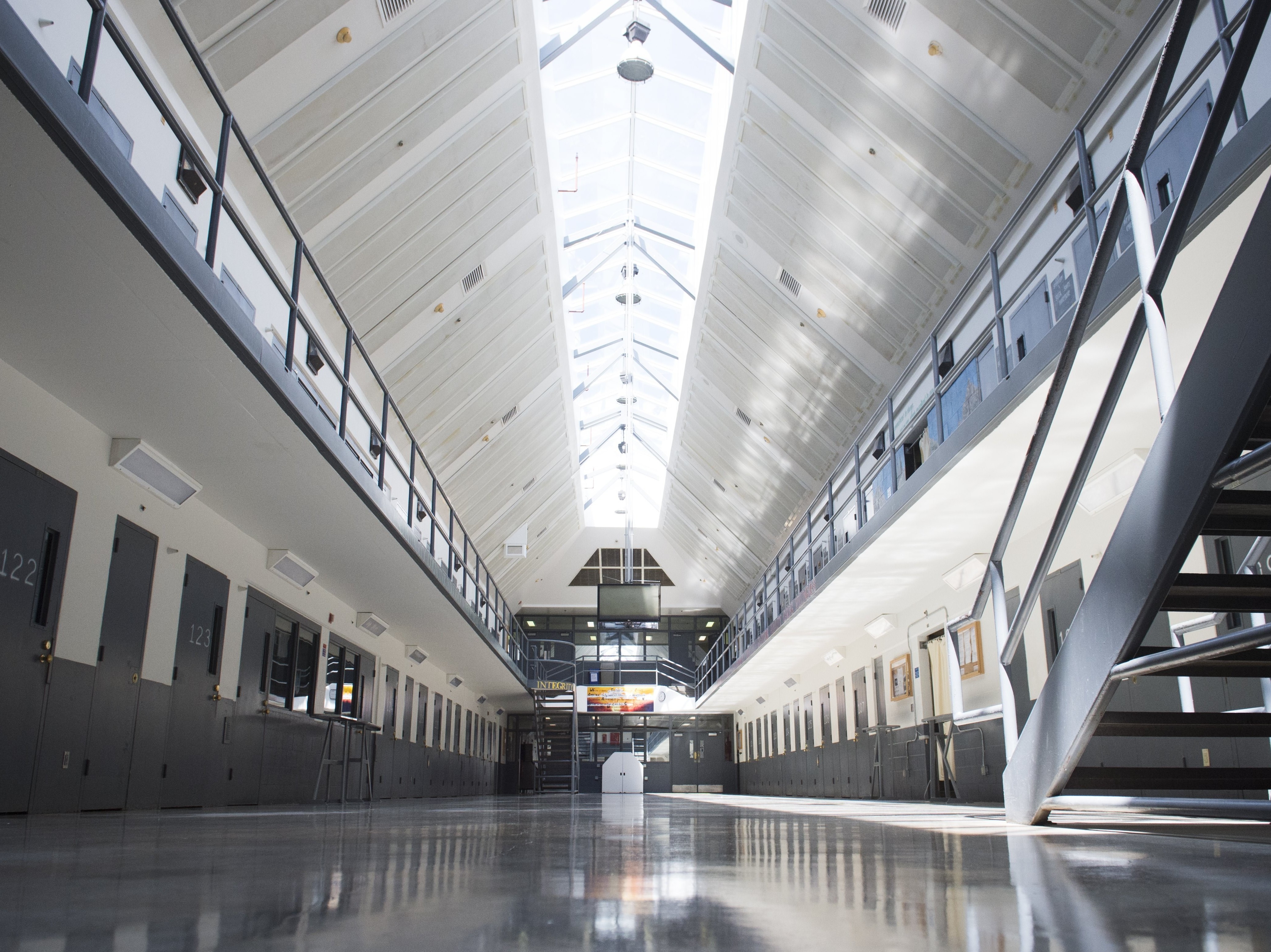 caption: Within the Federal Bureau of Prisons, inmates are asked to "voluntarily" agree to electronic monitoring in order to use the bureau's email system. Above, a prison cell block is seen at the Federal Correctional Institution, El Reno in Oklahoma in 2015.