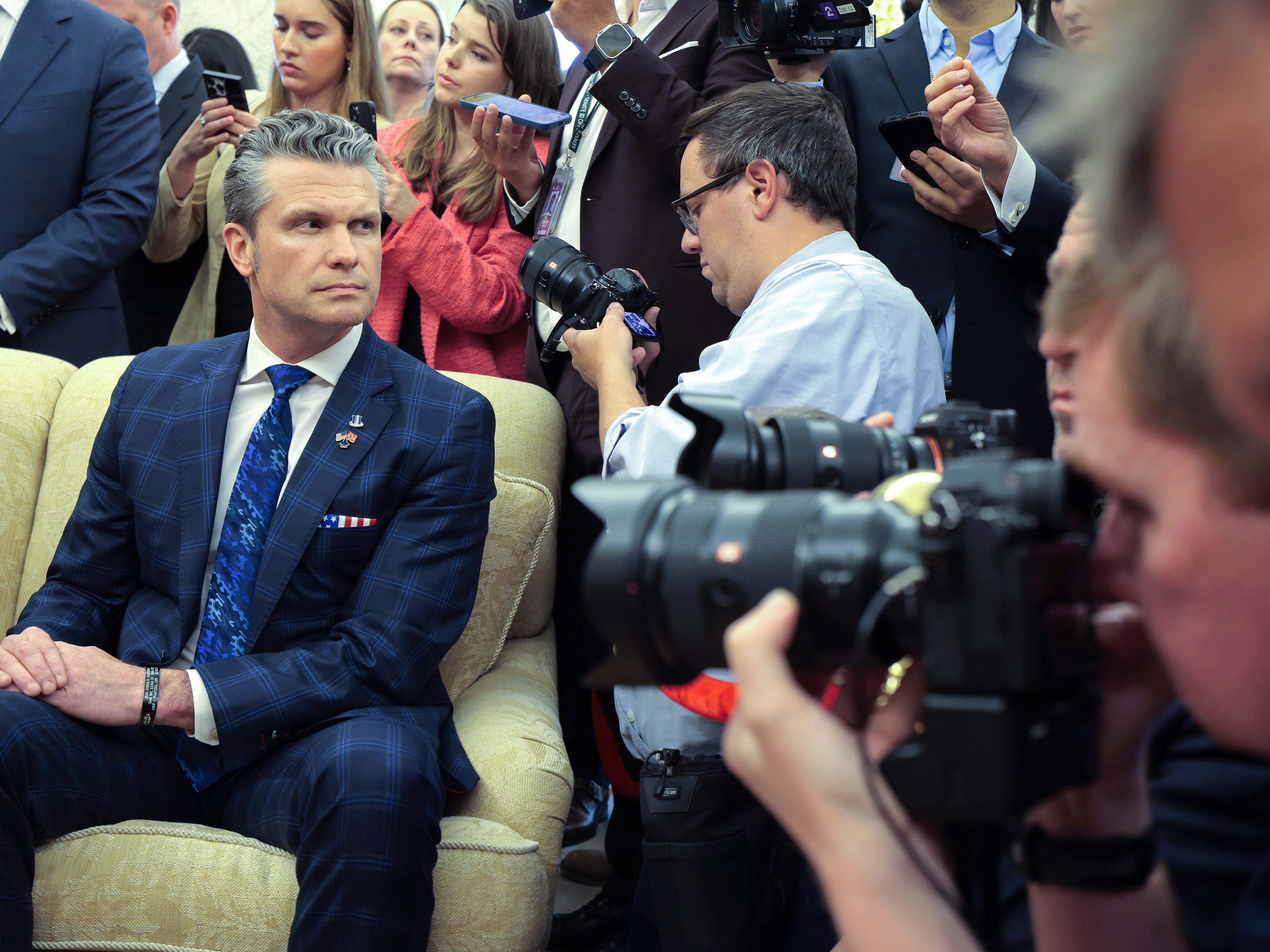 caption: Secretary of Defense Pete Hegseth attends an Oval Office meeting with President Trump and Norway's Prime Minister Jonas Gahr Store at the Oval Office on April 24.