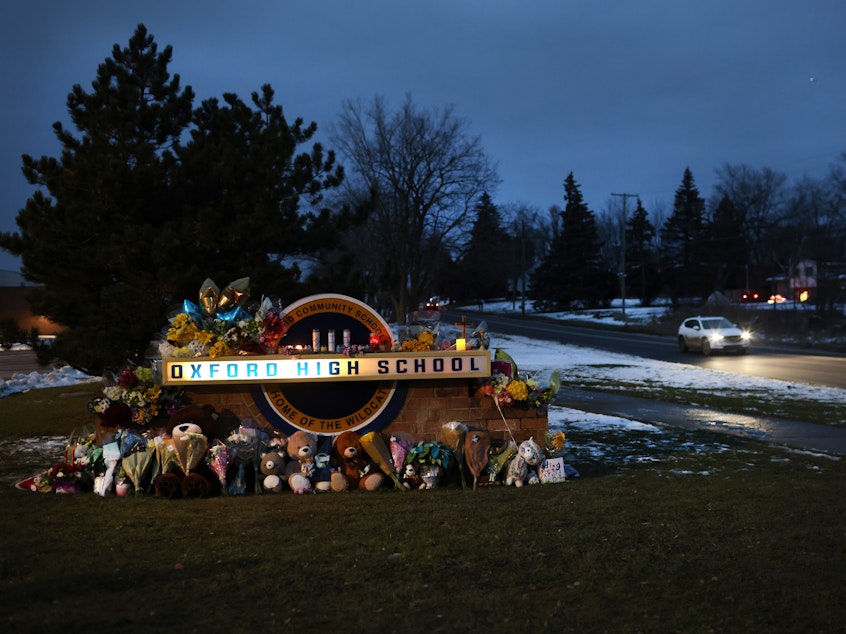 caption: A makeshift memorial sits outside Oxford High School in Oxford, Mich., last week.