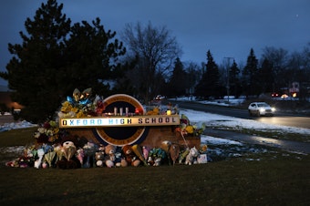 caption: A makeshift memorial sits outside Oxford High School in Oxford, Mich., last week.