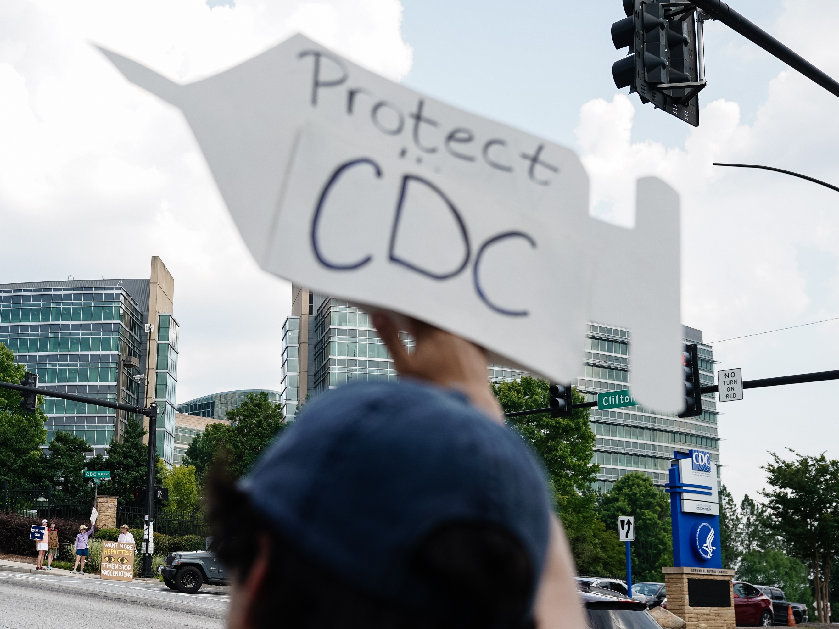 caption: Protesters gather outside the Centers for Disease Control and Prevention in Atlanta on Wednesday, during a controversial vaccine advisory committee meeting.