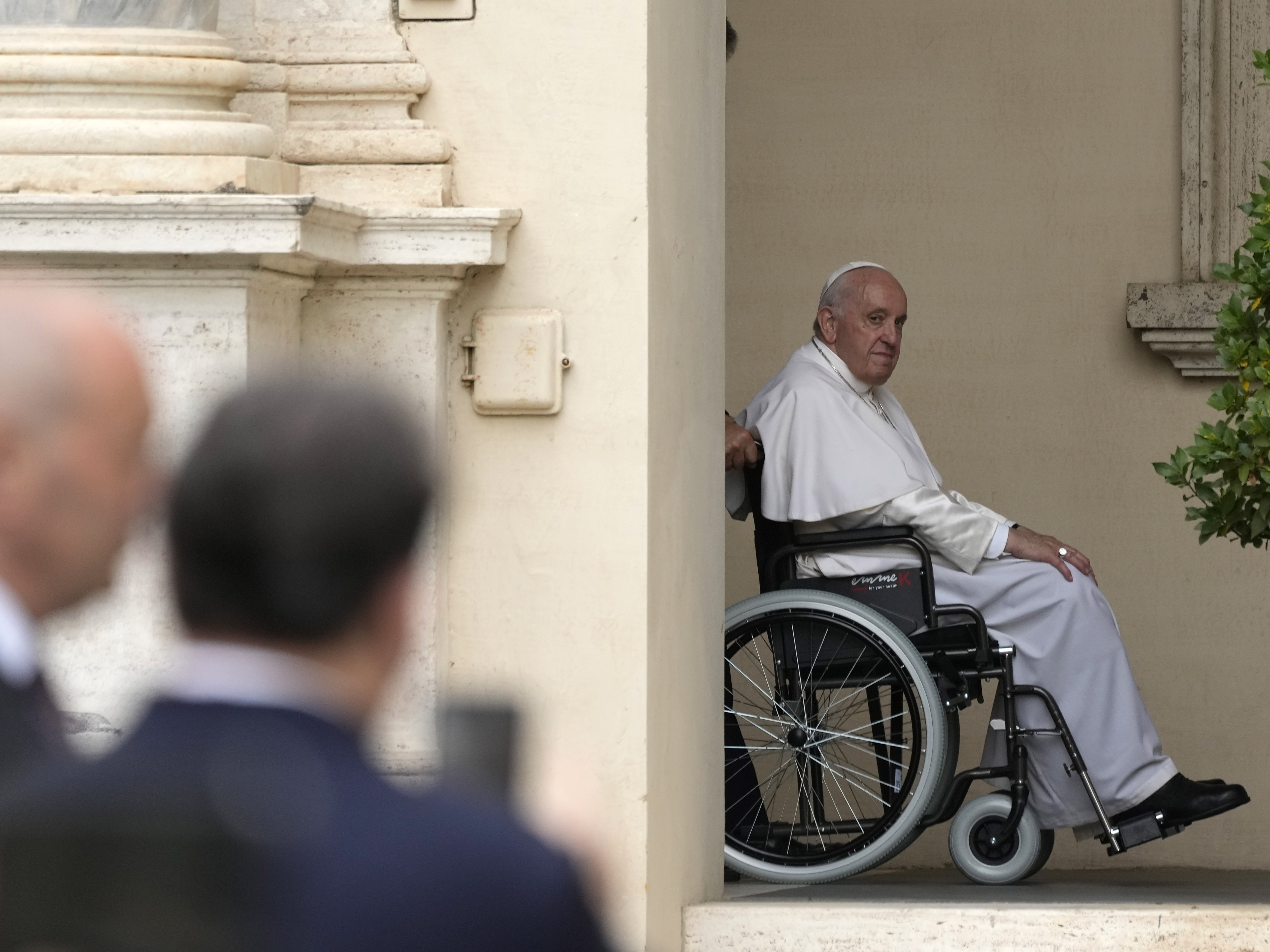 caption: Pope Francis arrives on a wheelchair for an audience with children in the San Damaso courtyard at the Vatican, June 4, 2022.