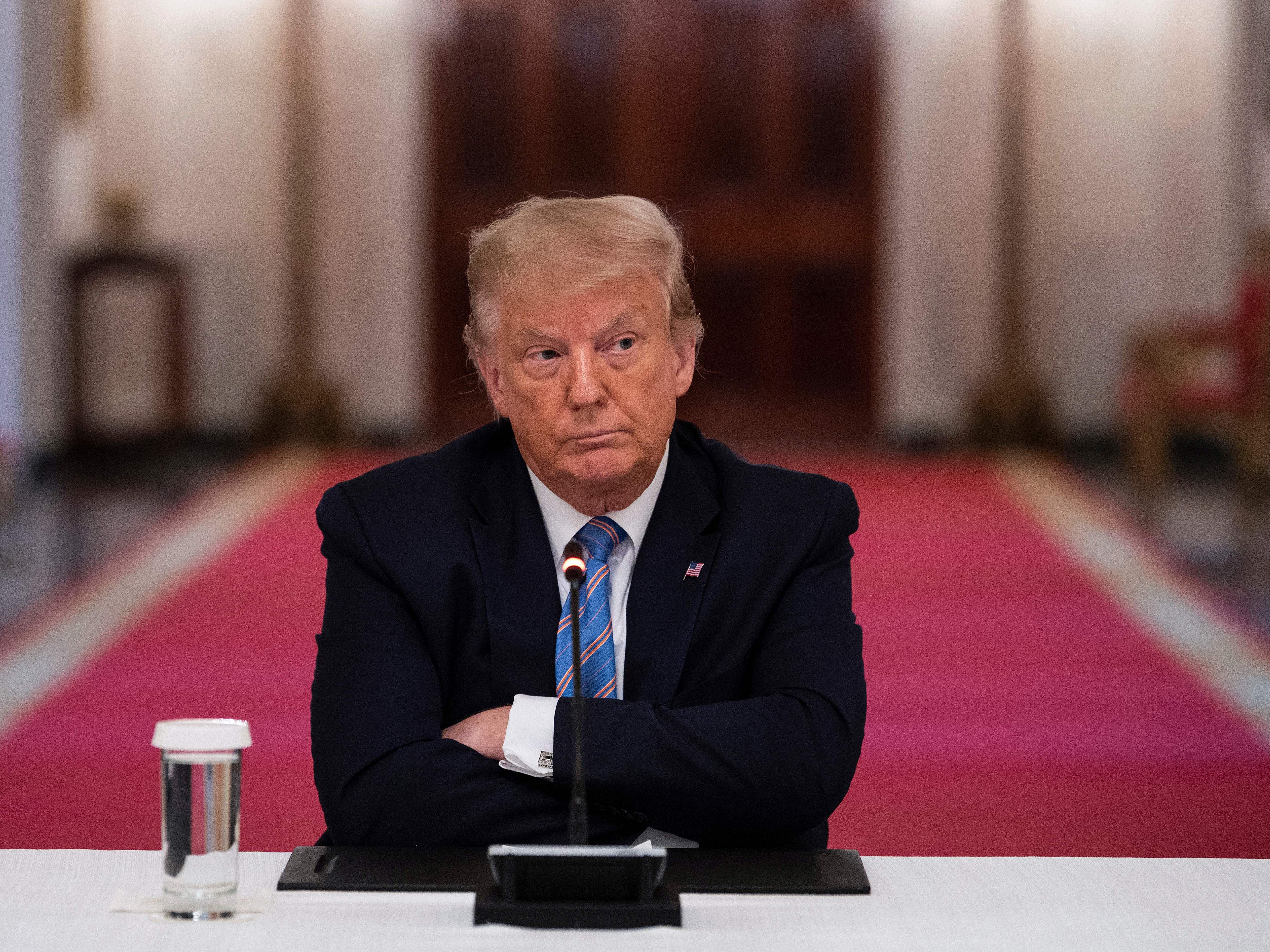 caption: President Trump participates in a White House event Tuesday on how to reopen schools safely. After insisting that the Republican National Convention should be in person with thousands of people, Trump said he is "flexible" about the format.