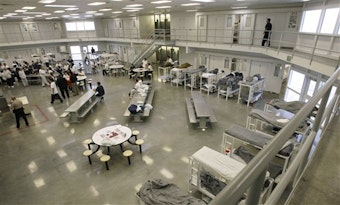 caption: A file picture from Oct. 17, 2008, shows the "B" cell and bunk unit of the Northwest Detention Center in Tacoma, Wash. 
