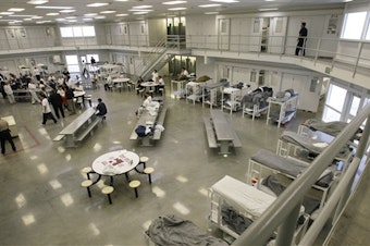 caption: A file picture from Oct. 17, 2008, shows the "B" cell and bunk unit of the Northwest Detention Center in Tacoma, Wash. 