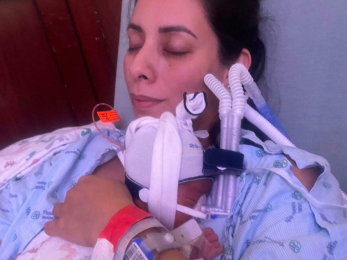 caption: Teresa Hernandez with baby Lucca.