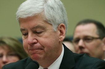 caption: Now Former Michigan Gov. Rick Snyder, (R-MI), listens to Congressional members remarks during a House Oversight and Government Reform Committee hearing, about the Flint, Mich. water crisis in 2016.