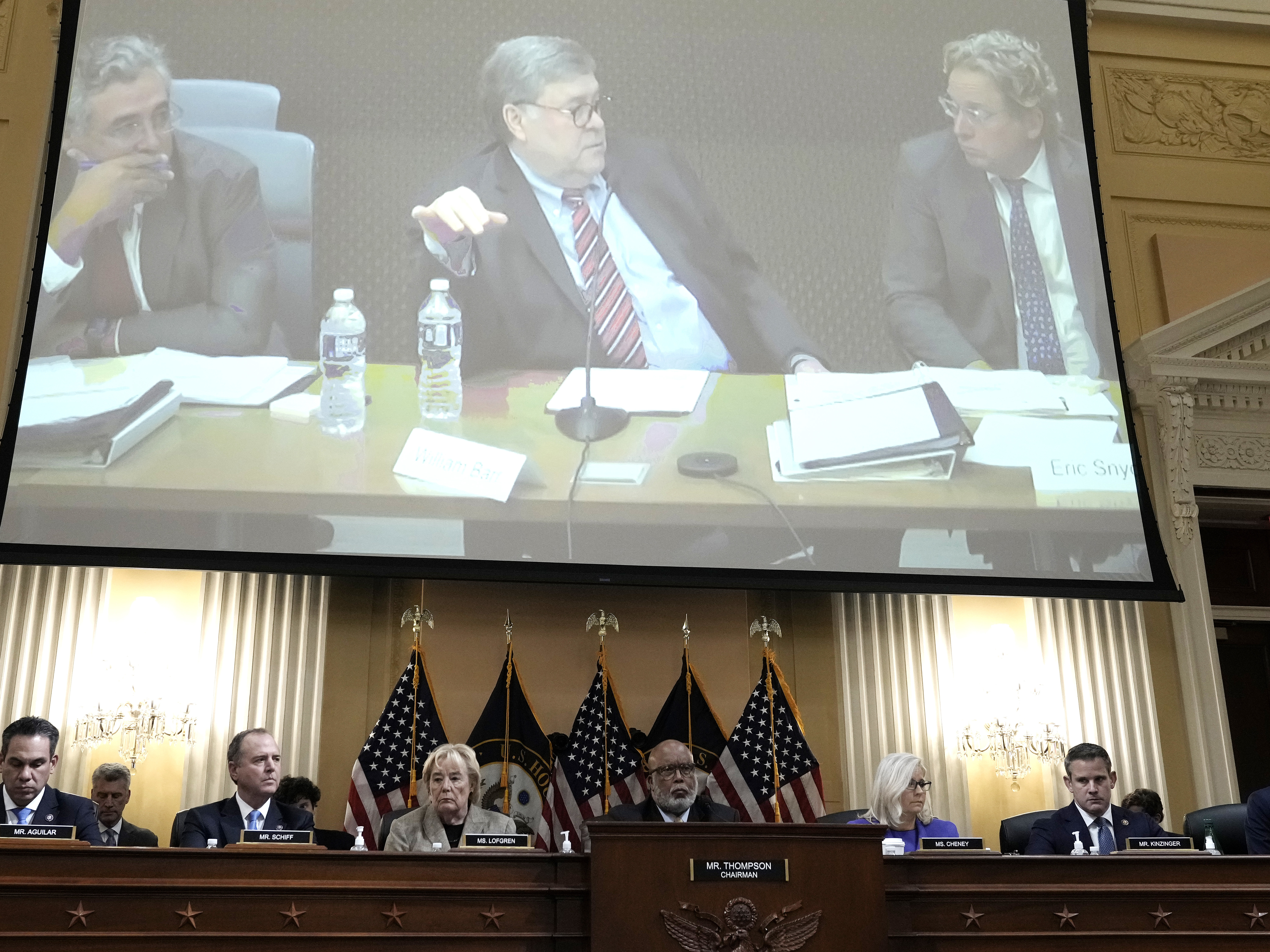 caption: Former Attorney General Bill Barr is seen on a screen during a hearing held by the House Jan. 6 committee on Monday.