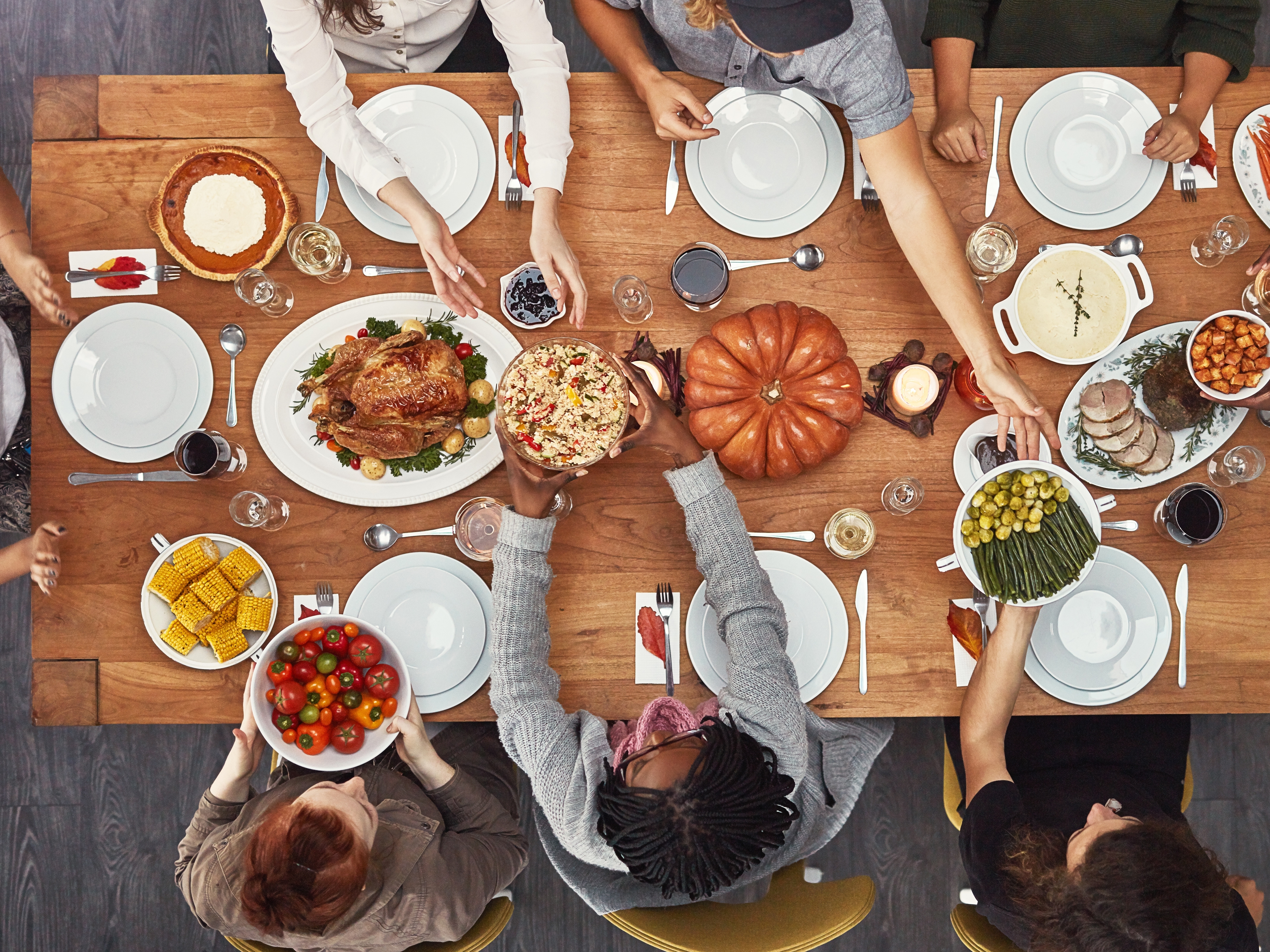 caption: "Friendsgiving" describes a meal, usually potluck-style, shared with friends around the time of Thanksgiving. The custom may be centuries old, but the word only entered Merriam-Webster's dictionary in 2020.