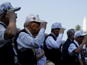 caption: Korean War veterans from the Republic of Korea salute at a ceremony Thursday at the Korean War Veterans Memorial in Washington, D.C., commemorating the anniversary of the Korean Armistice Agreement. The agreement was signed July 27, 1953.