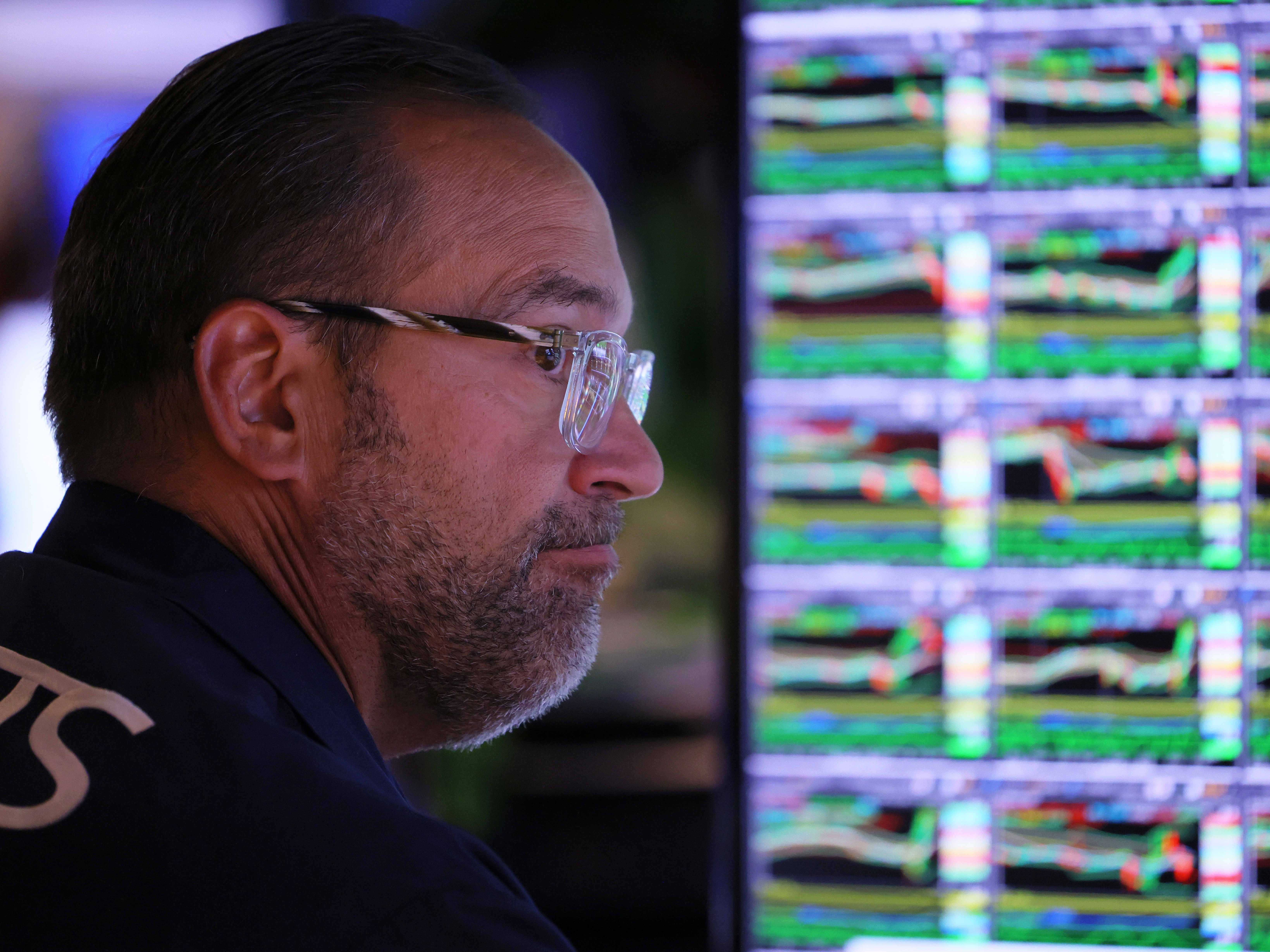 caption: Traders work on the floor of the New York Stock Exchange on September 21, 2022 in New York City. Stocks dropped in the final hour of trading after Federal Reserve Chairman Jerome Powell announced that the Federal Reserve will raise interest rates by three-quarters of a percentage point in an attempt to continue to tame inflation.