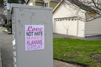 caption: The community response to the racist vandalism has been swift. These, and other signs, are now found all over Klahanie.