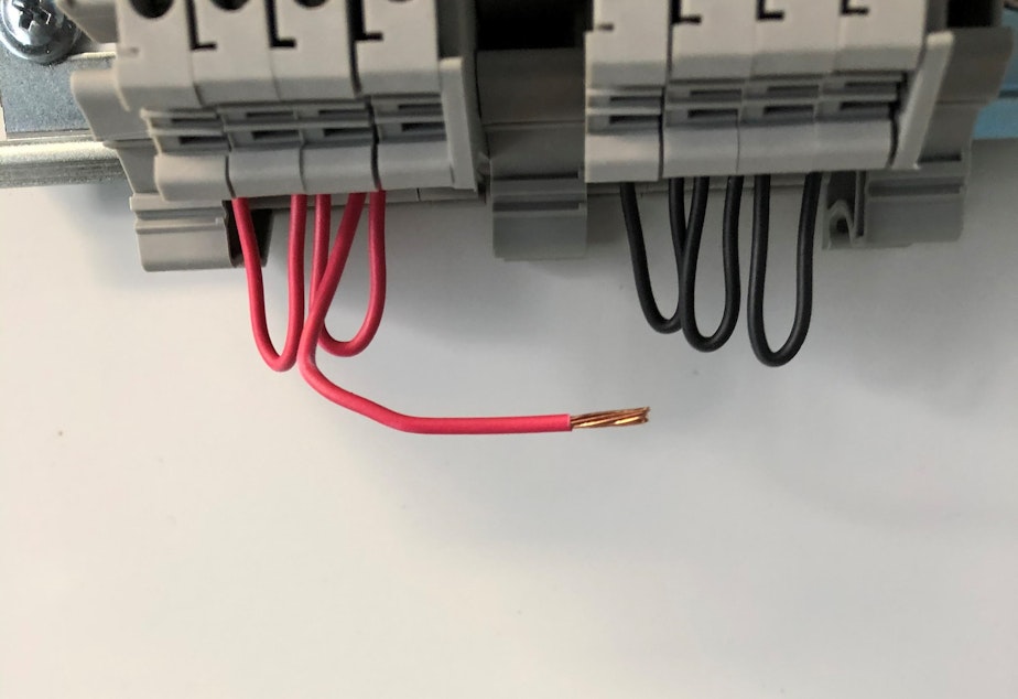 caption: A March 2021 photo sent between maintenance employees shows a wire that pulled loose from a controller in the HVAC system at the Clark Children and Family Justice Center. 