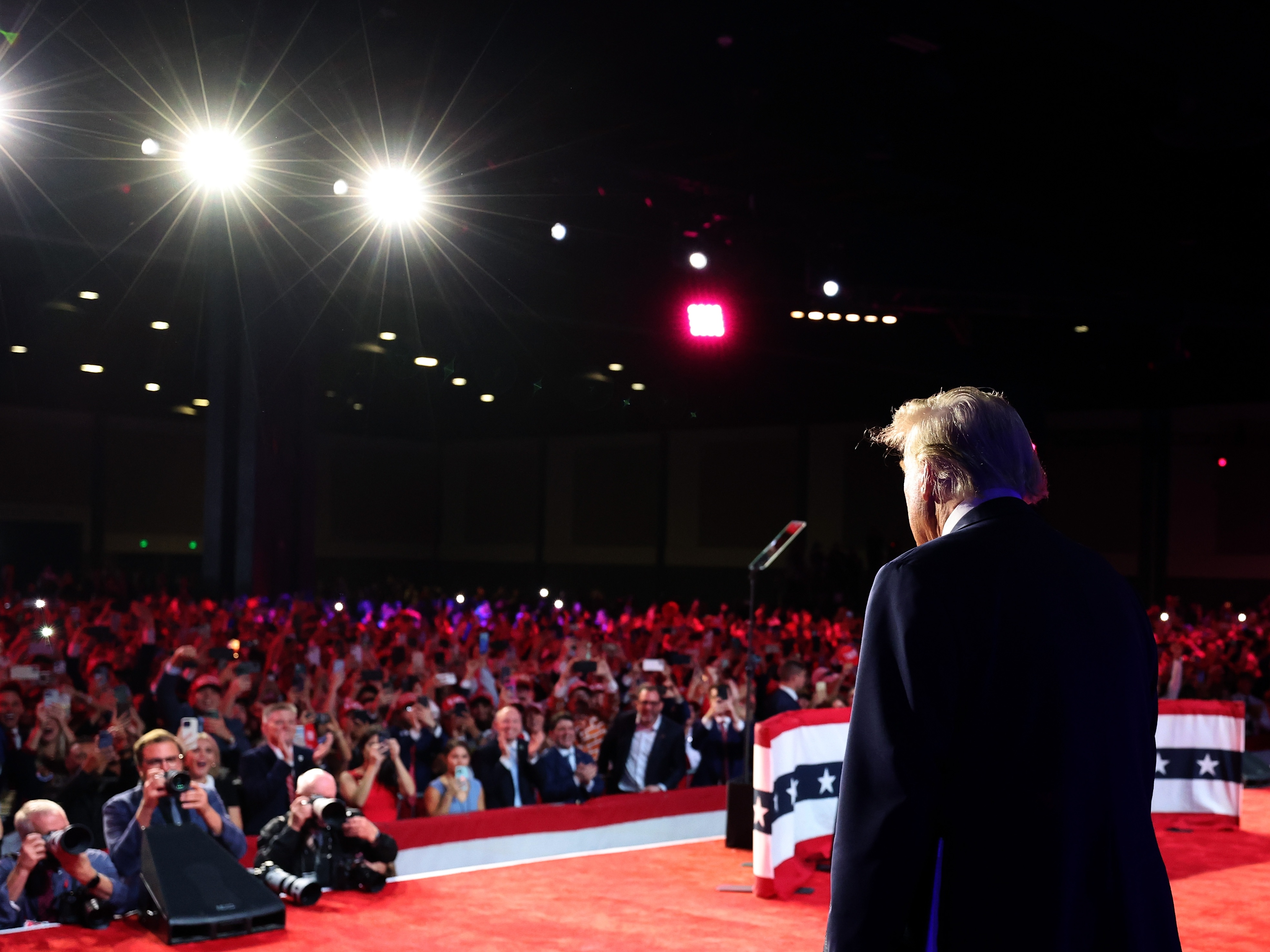 caption: Former President Donald Trump arrives to speak during an election night event on Nov. 6 in West Palm Beach, Fla.
