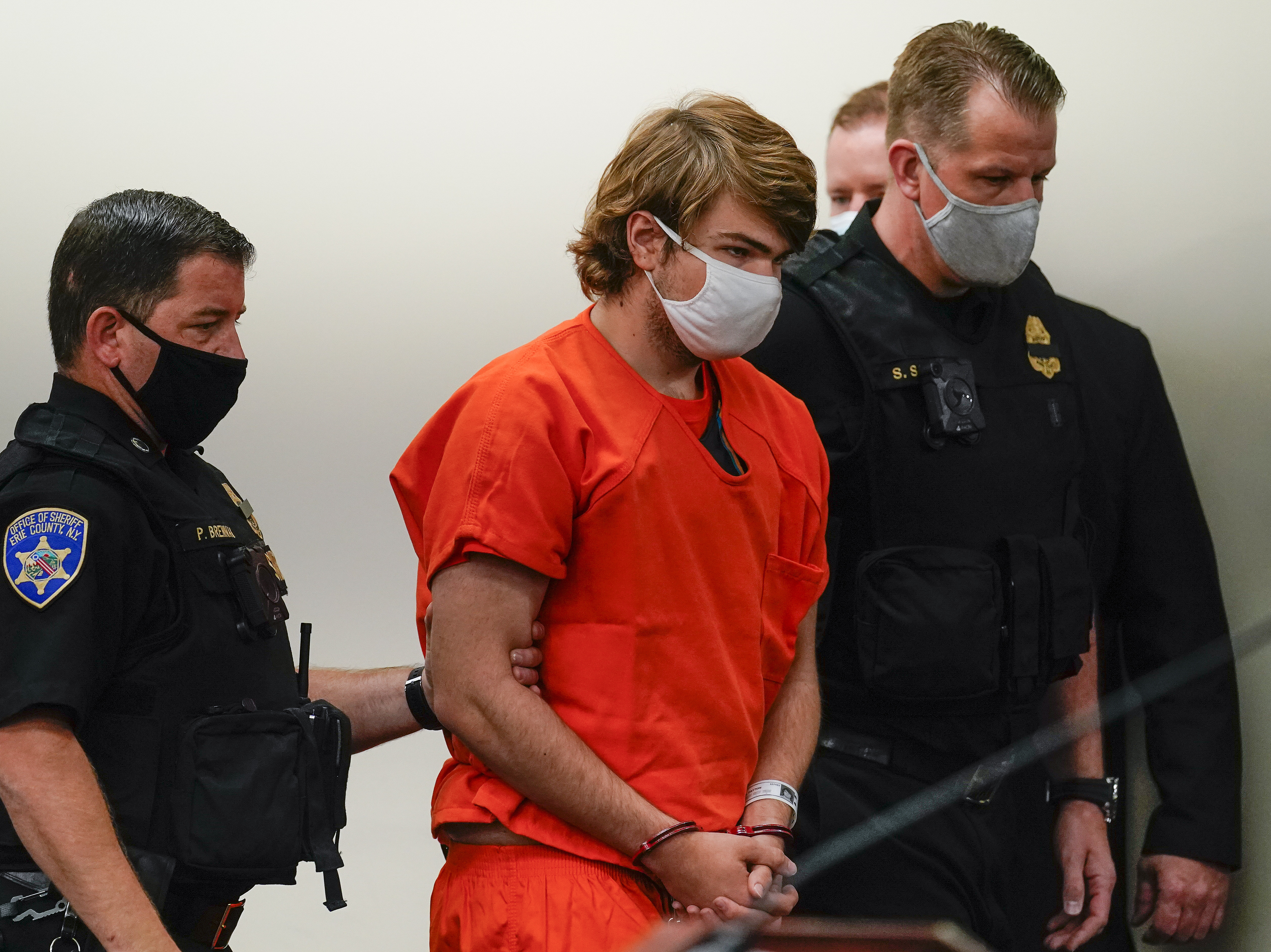 caption: Payton Gendron is led into the courtroom for a hearing at Erie County Court, in Buffalo, N.Y. on May 19.