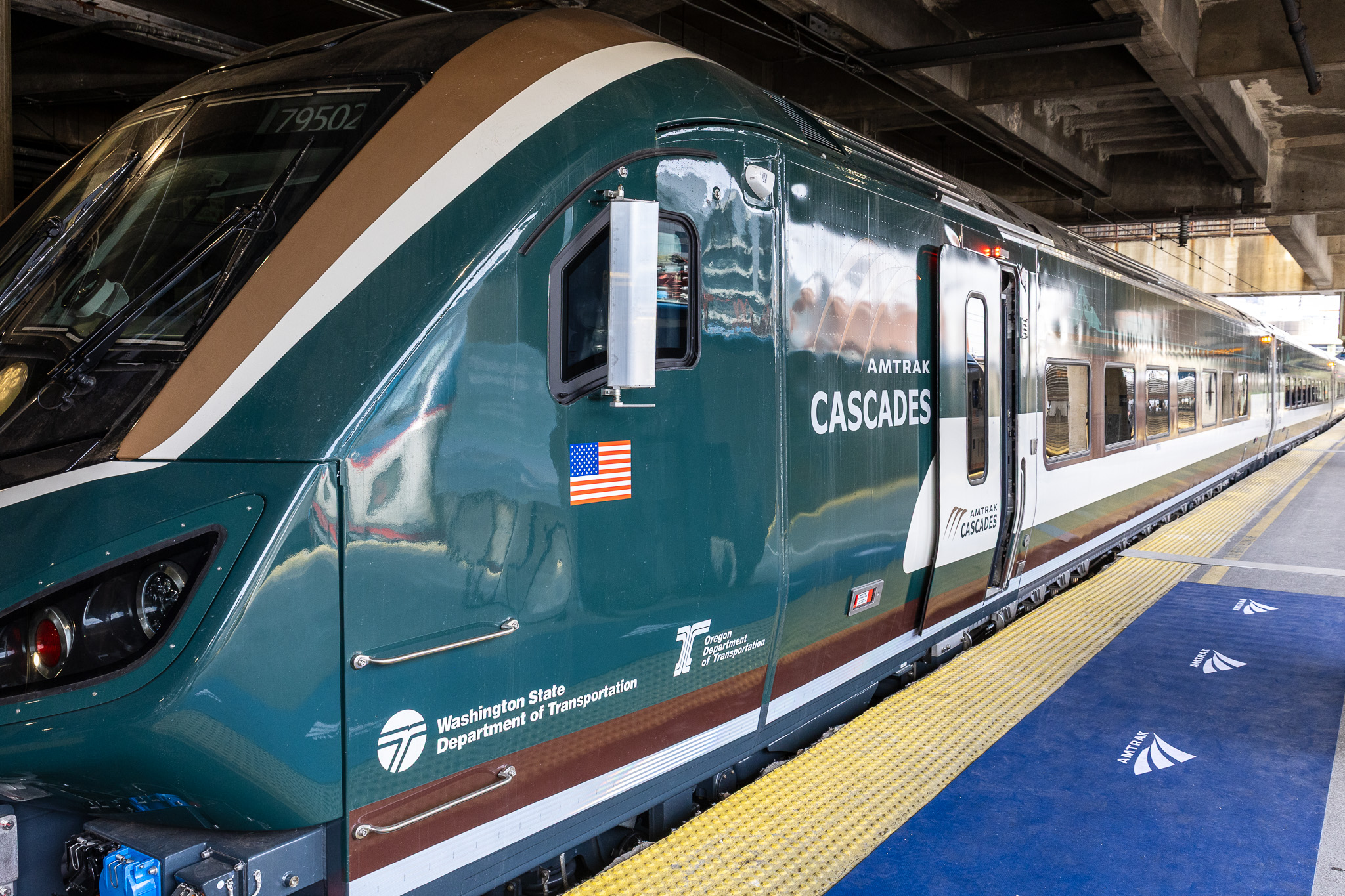 caption: The first of Amtrak’s new “Airo” trains took a timeout from testing in February to show off its Northwest color scheme and modern features for suitably impressed federal officials and media in Washington, D.C.