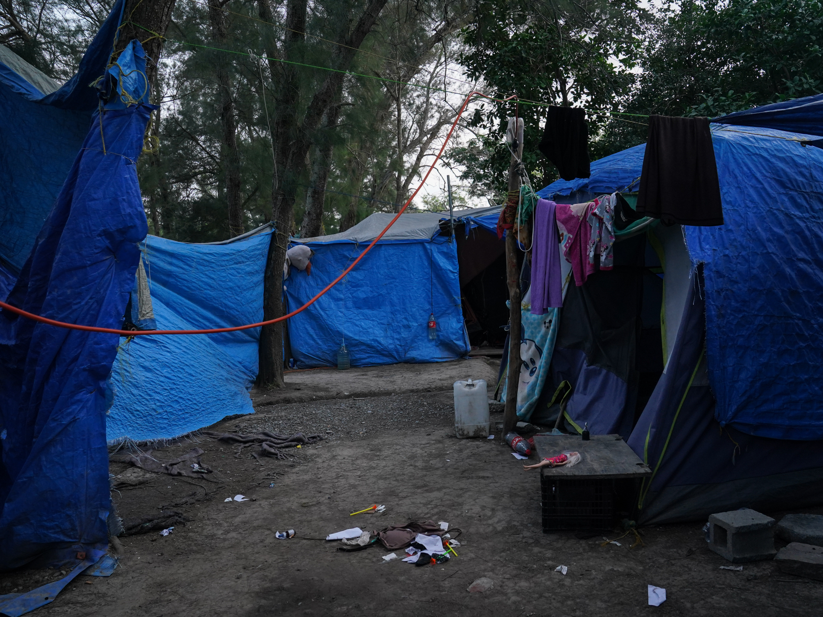 caption: Abandoned tents remain at the migrant camp in Matamoros, Mexico, that is at the center of a controversy involving viral images of a flyer encouraging migrants to vote for President Biden.