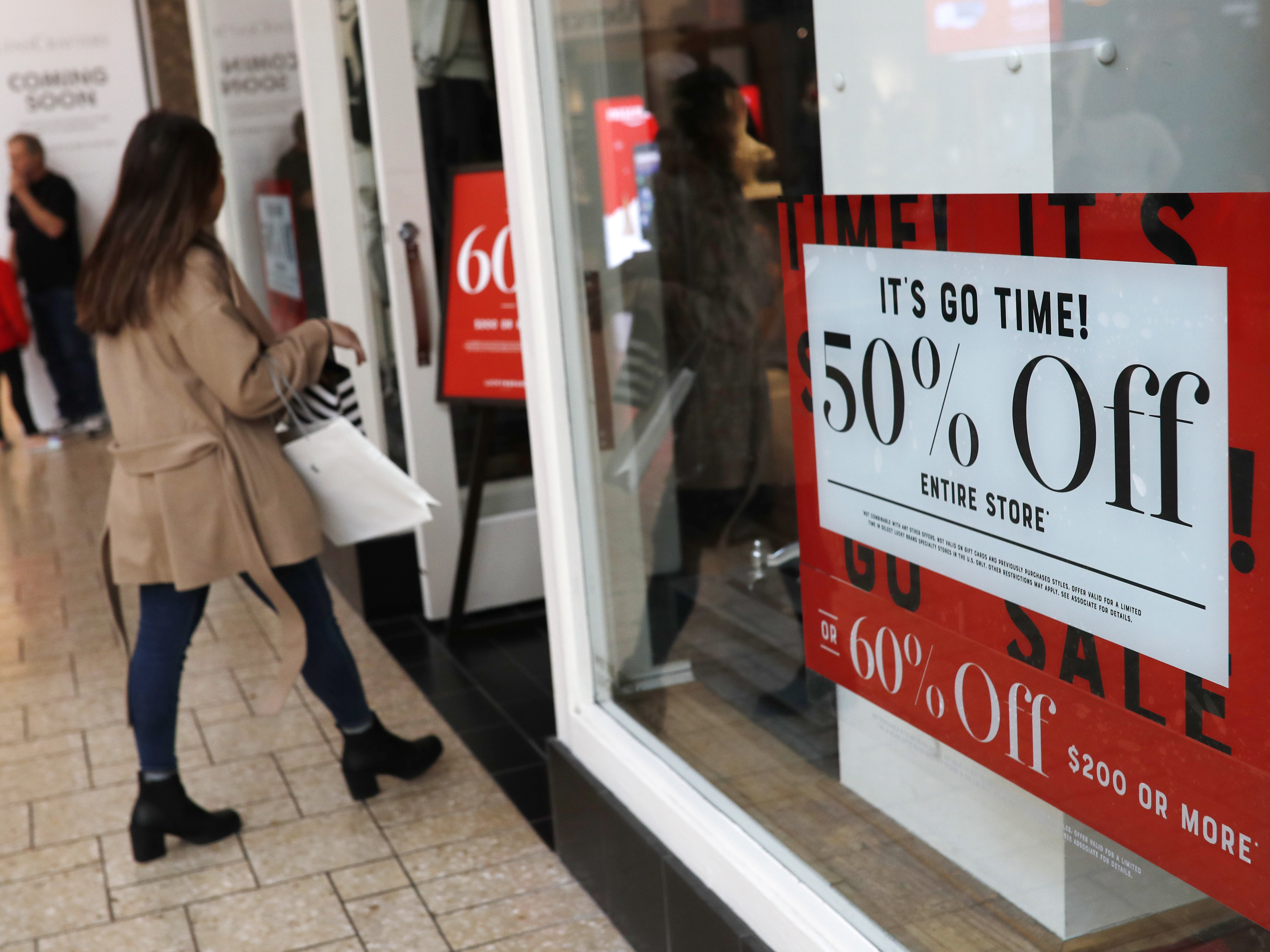 caption: Holiday shoppers at the Cherry Creek Mall in Denver, Dec. 24, 2018. The U.S. economy grew more slowly at the end of 2018 than initially thought. The slowdown is expected to continue in 2019.