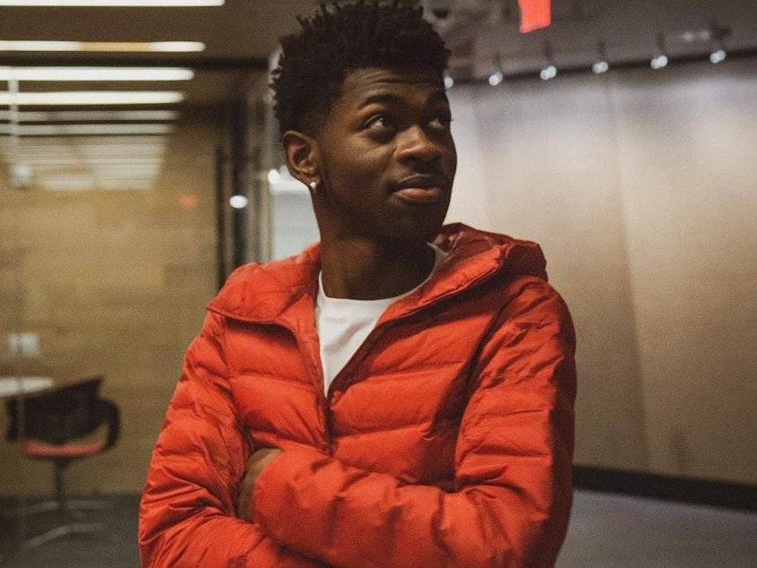 caption: Despite Lil Nas X's viral hit "Old Town Road" having a blend of rap and country elements, <em>Billboard</em> removed the song from its Hot Country Songs chart.
