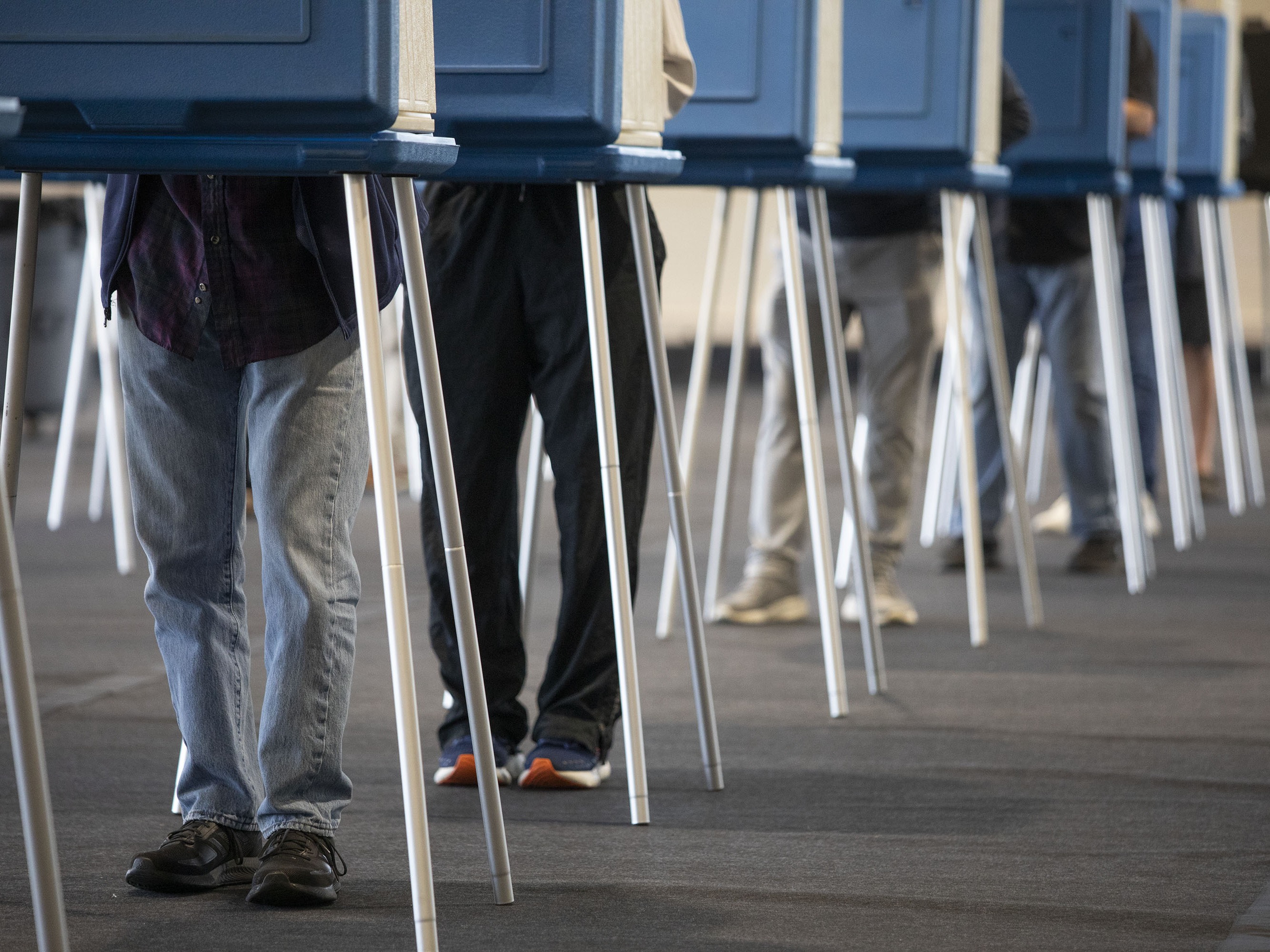 caption: Voters in Dearborn cast ballots Tuesday, during Michigan's early voting period. Elon Musk recently surfaced a baseless claim about the state's voter rolls.