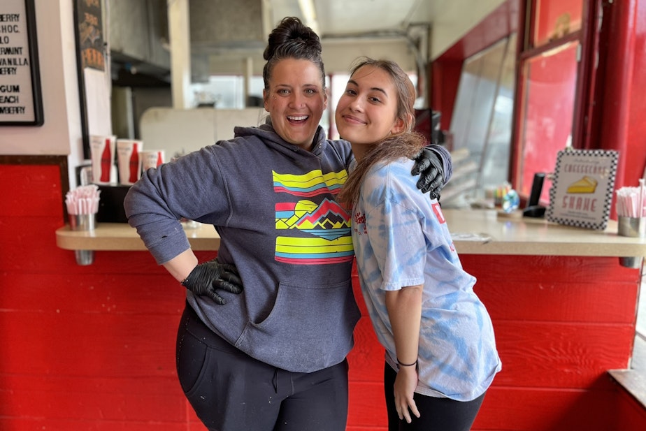 caption: Jayme Harris (left) and Jenna Randall (right) of the Dairy Freeze in North Bend.