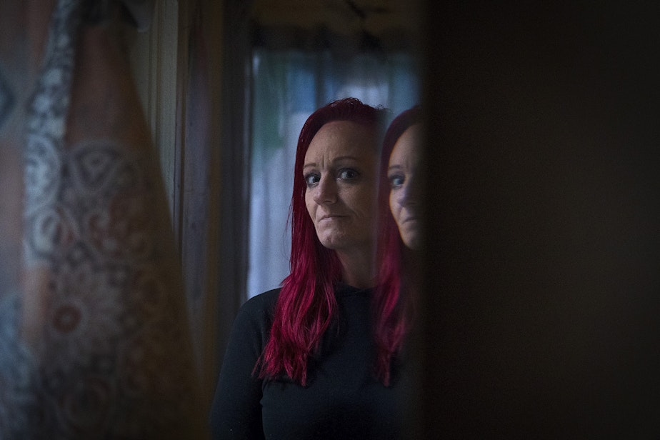 caption: Robin Curtis is portrayed in her room at a downtown Seattle shelter on Friday, November 15, 2019.