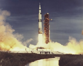 caption: Saturn V launch. (Courtesy WGBH/NASA)