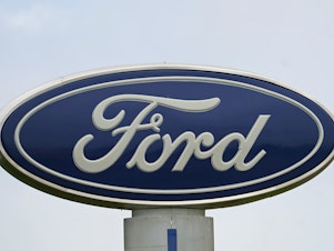 caption: A Ford logo is seen on a sign at Country Ford in Graham, N.C. The auto manufacturer has issued a recall that affects about 39,000 SUVs.