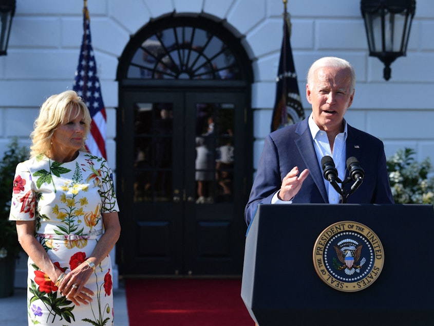 caption: President Biden, with First Lady Jill Biden at his side, delivers remarks at a 4th of July BBQ with military families at the White House.