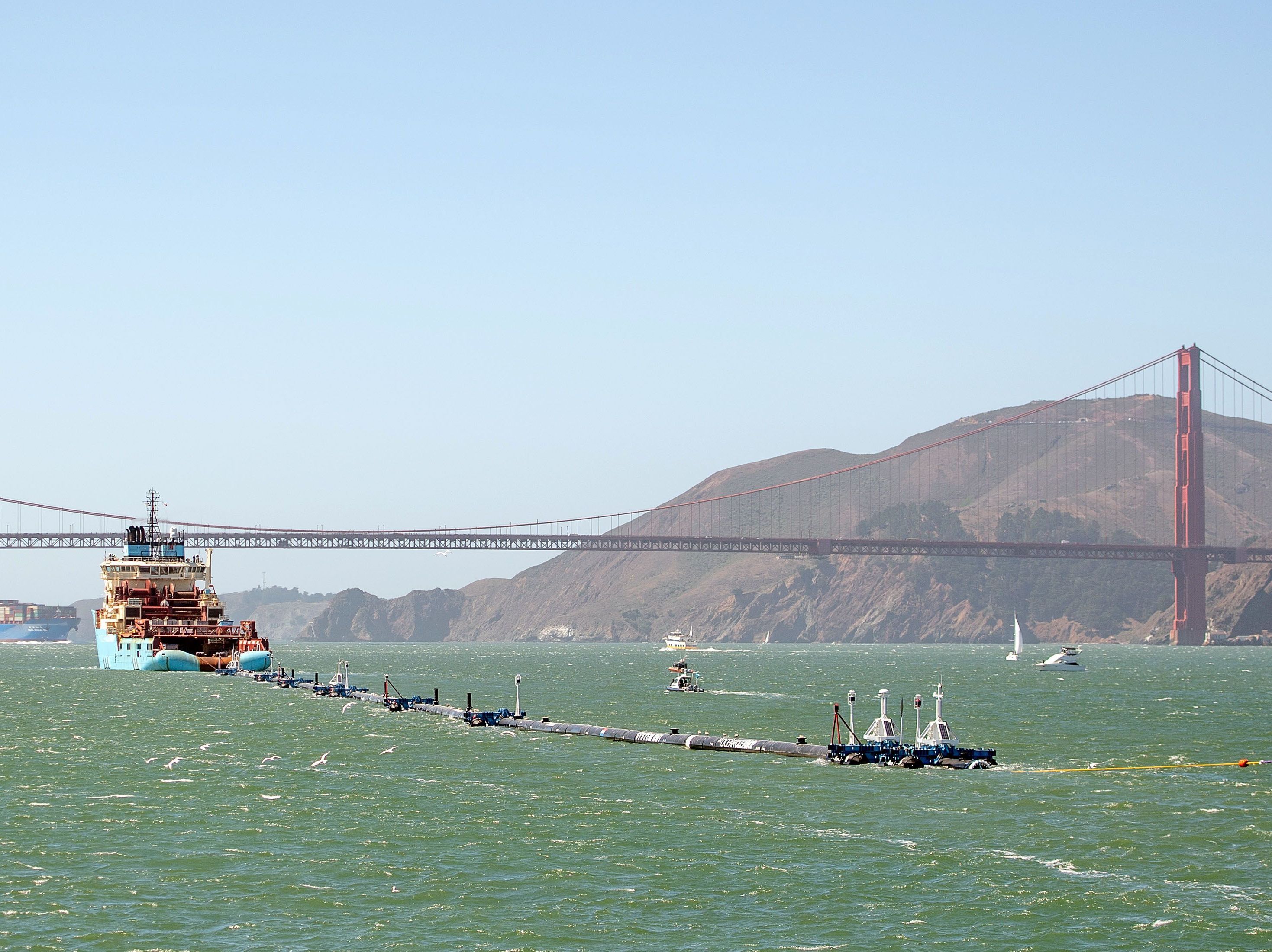 caption: Ocean Cleanup's System 001 was towed out of the San Francisco Bay on Sept. 8, 2018.