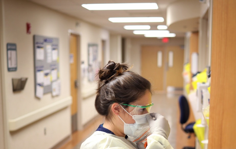 caption: Nurses in the intensive care unit of MedStar St. Mary's Hospital check the fit of protective equipment before entering a patient's room March 24, 2020 in Leonardtown, Maryland. (Win McNamee/Getty Images)