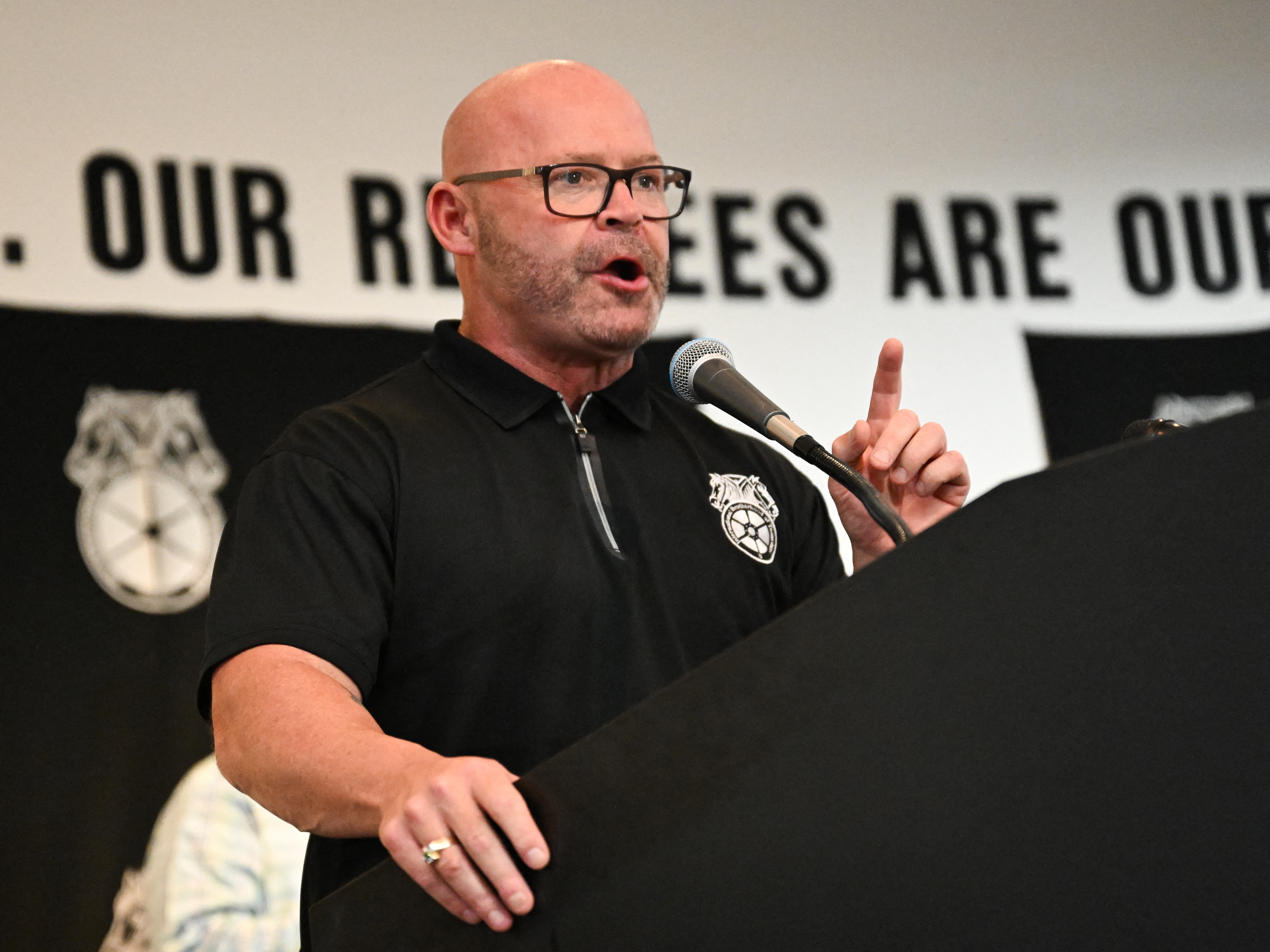 caption: Teamsters General President Sean M. O'Brien speaks during a rally with workers and union members as part of an "Amazon Teamsters Day of Solidarity" on Aug. 29, 2024 in Long Beach, California. 