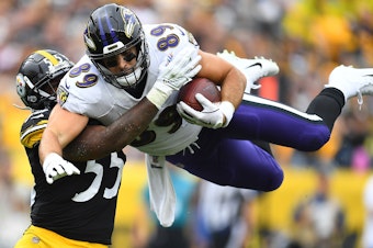 caption: Mark Andrews, right, of the Baltimore Ravens hurdles Devin Bush, left, of the Pittsburgh Steelers during the first quarter at Heinz Field on Oct. 6, 2019 in Pittsburgh. This season, the Thanksgiving matchup between the two teams has been canceled due to a coronavirus outbreak.