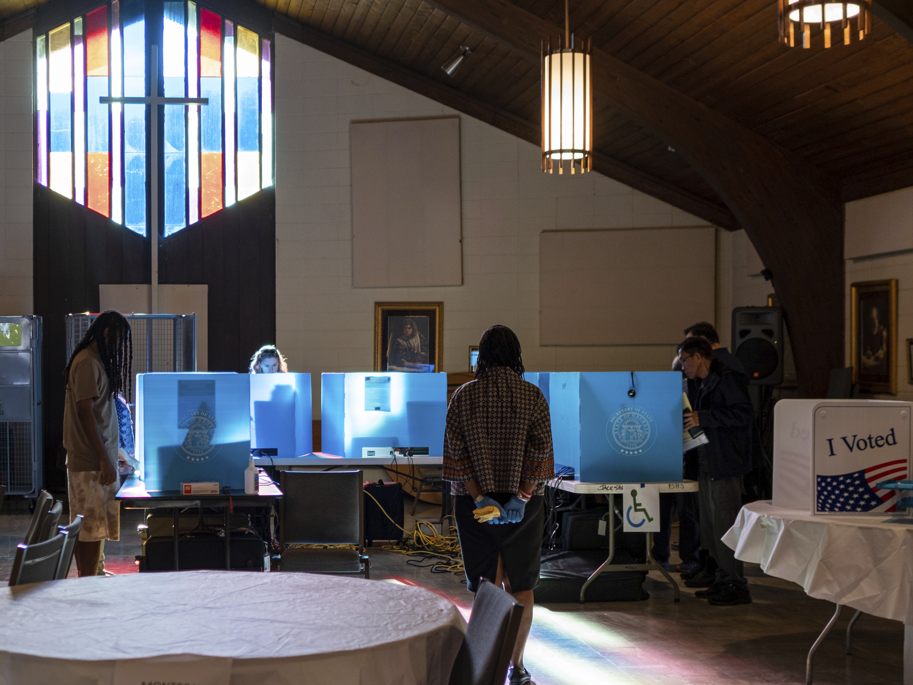 caption: Voters mark their ballots for the midterm election Nov. 8, 2022, at Lawrenceville Road United Methodist Church in Tucker, Ga.