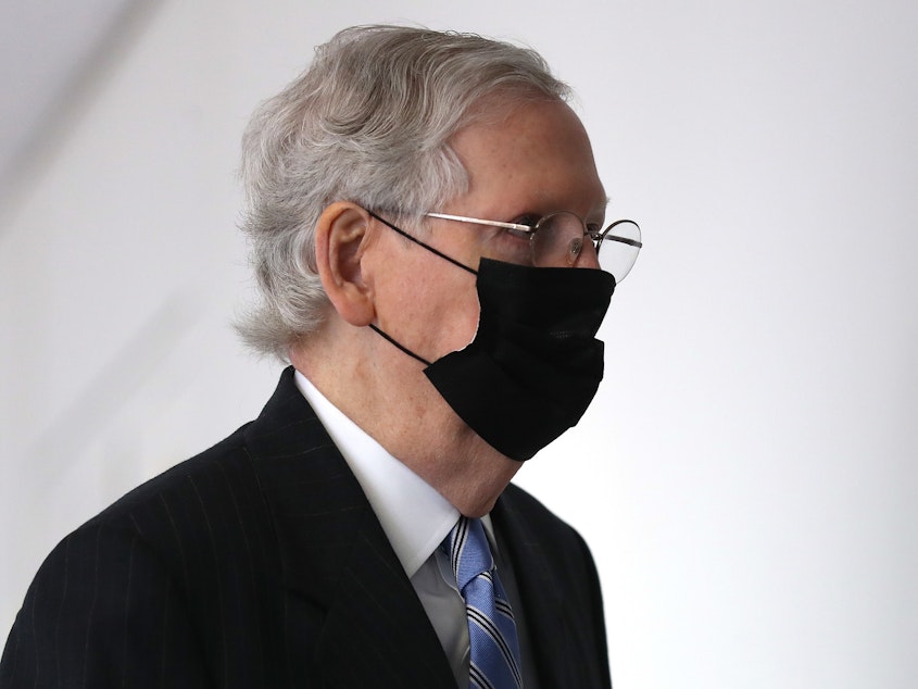 caption: Senate Majority Leader Mitch McConnell arrives for a Republican Senate luncheon Wednesday on Capitol Hill.