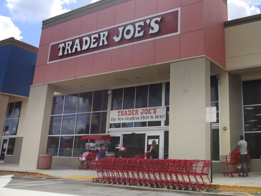caption: People stand in line waiting to enter Trader Joe's to buy groceries in Pembroke Pines, Fla., on March 24, 2020. More than 61,000 pounds of steamed chicken soup dumplings sold at Trader Joe's are being recalled for possibly containing hard plastic, U.S. regulators announced Saturday, March 2, 2024.
