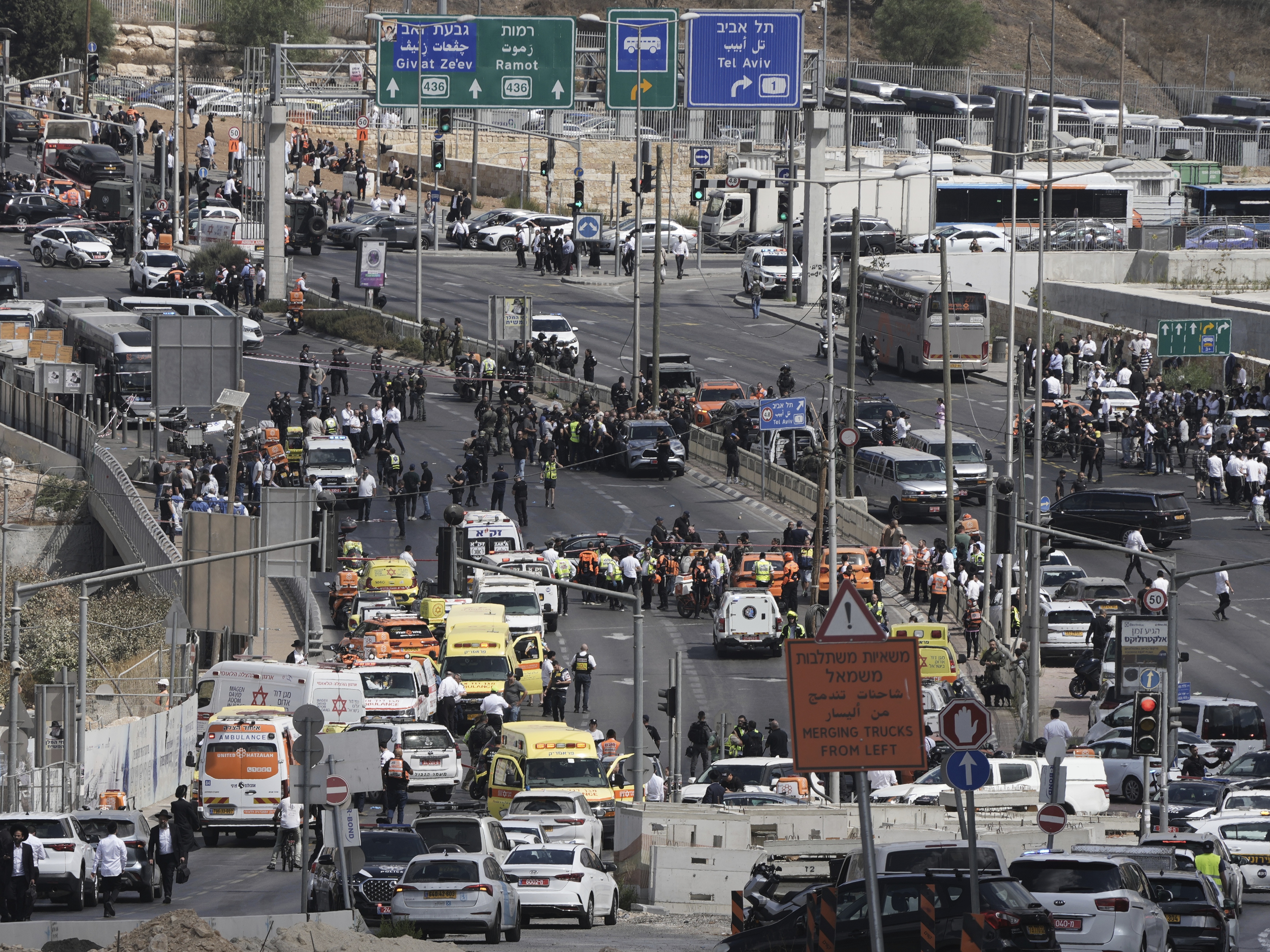 caption: Israeli police and rescue teams respond at the scene of a shooting attack where several people killed and injured in Jerusalem, Monday, Sept. 8, 2025.
