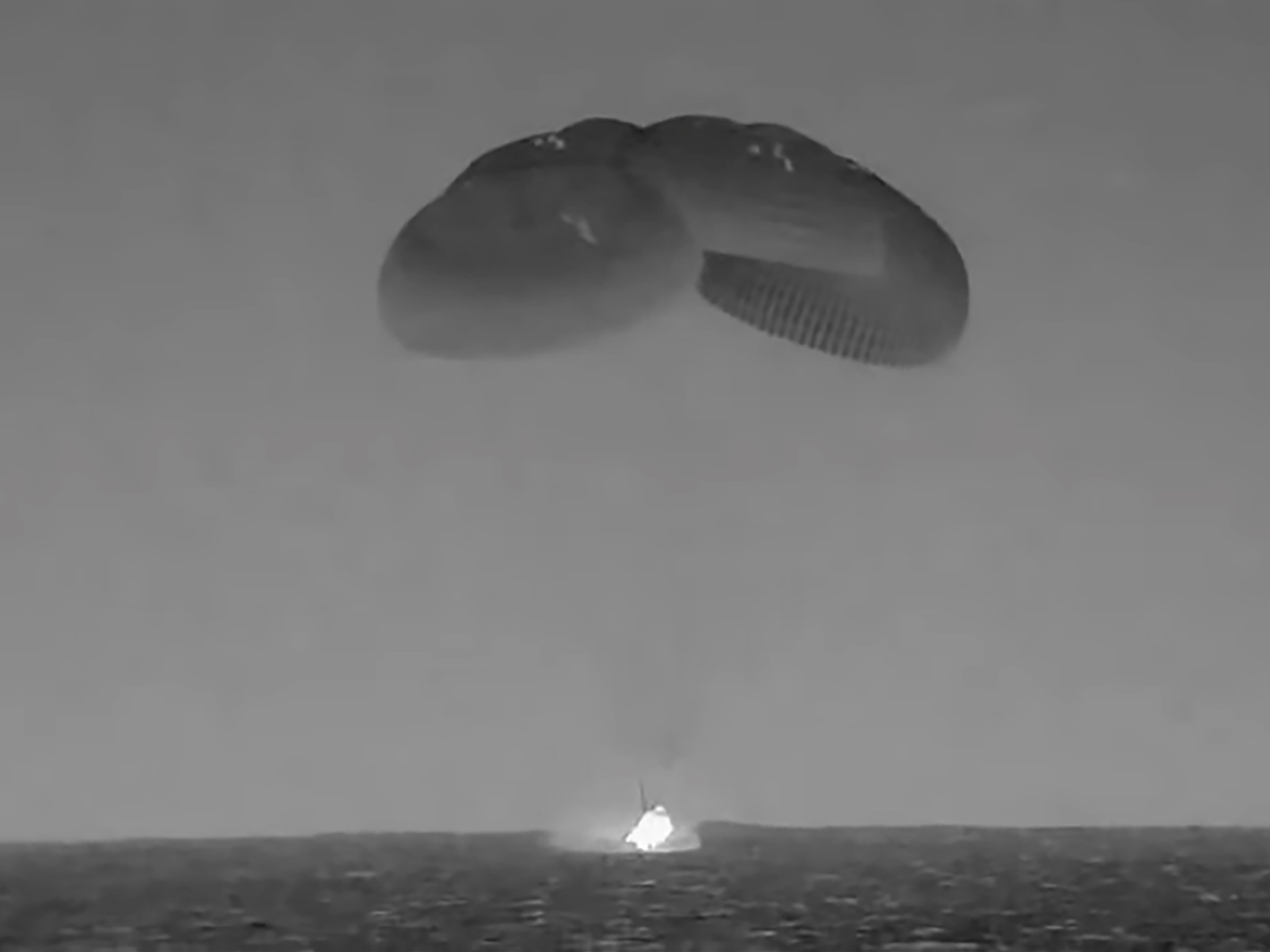 caption: In this image from video made available by NASA, the SpaceX Crew Dragon, slowed by parachutes, splashes down in the Atlantic Ocean off the Florida coast, Monday, Sept. 4, 2023, as it returns to Earth with NASA astronauts Stephen Bowen and Woody Hoburg, United Arab Emirates astronaut Sultan AlNeyadi and Roscosmos cosmonaut Andrey Fedyaev after a six-month stay at the International Space Station.