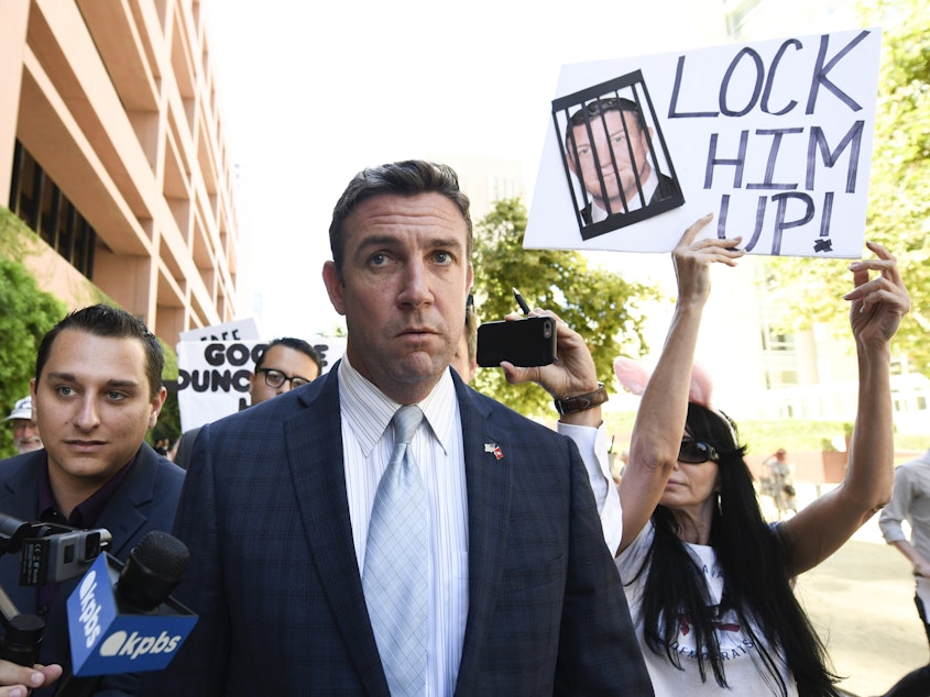 caption: Rep. Duncan Hunter, R-Calif.,  leaves federal court after a hearing in San Diego in July.