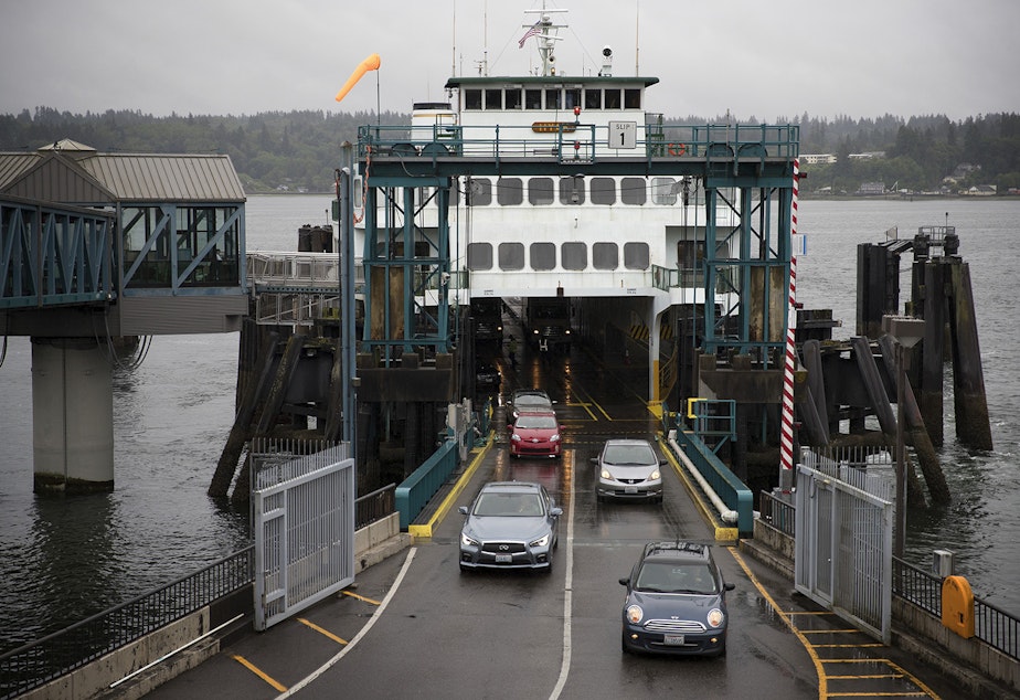 caption: Cars drive off of the Hyak ferry shortly after arriving in Bremerton, Washington, on Thursday, June 8, 2017. 